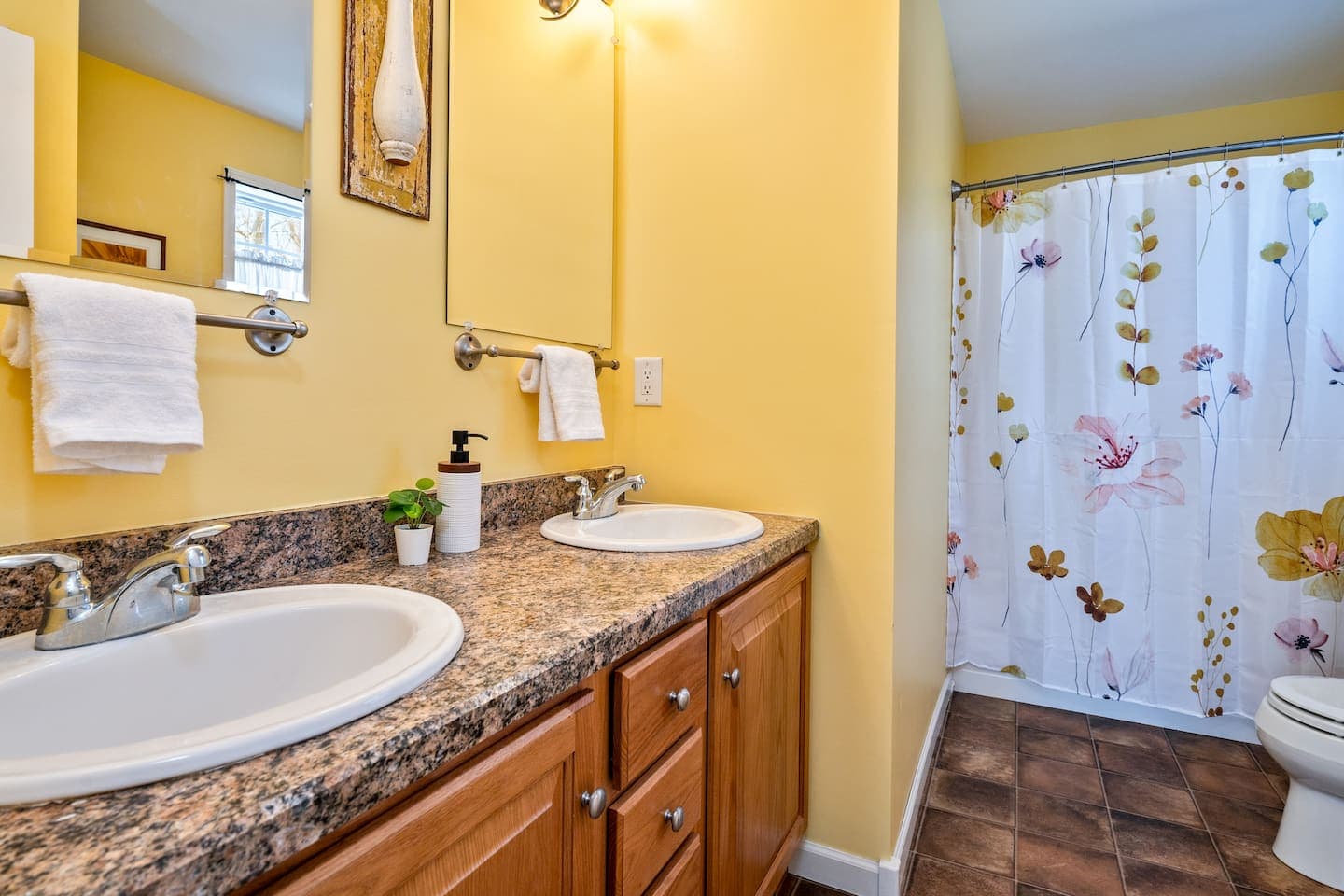Bathroom with double vanity and enclosed shower 