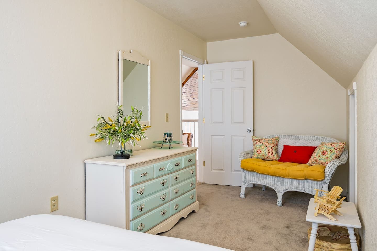 Bedroom with dresser and reading chair