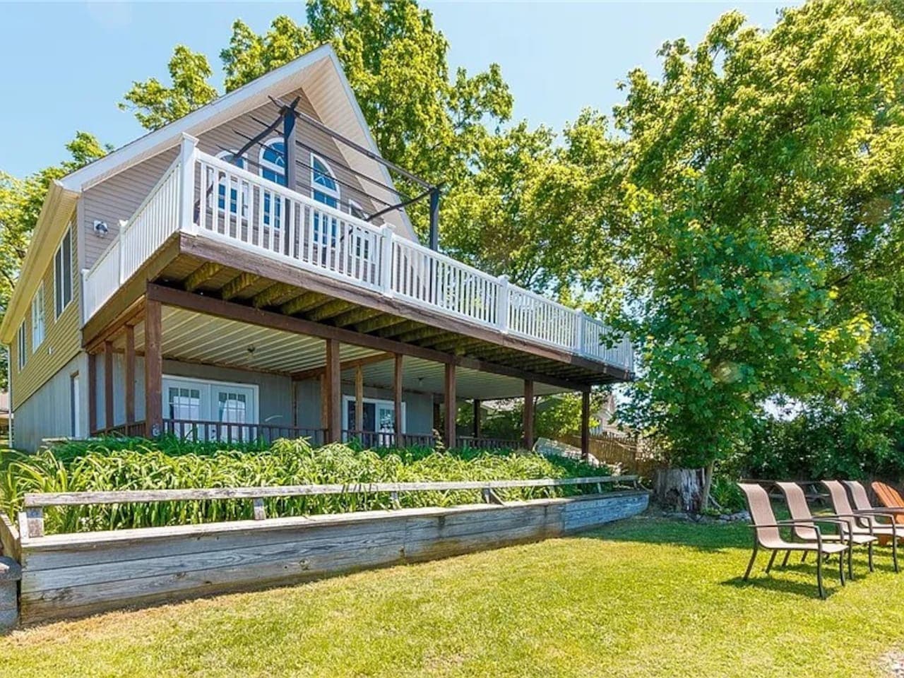 Lake house exterior with raised deck