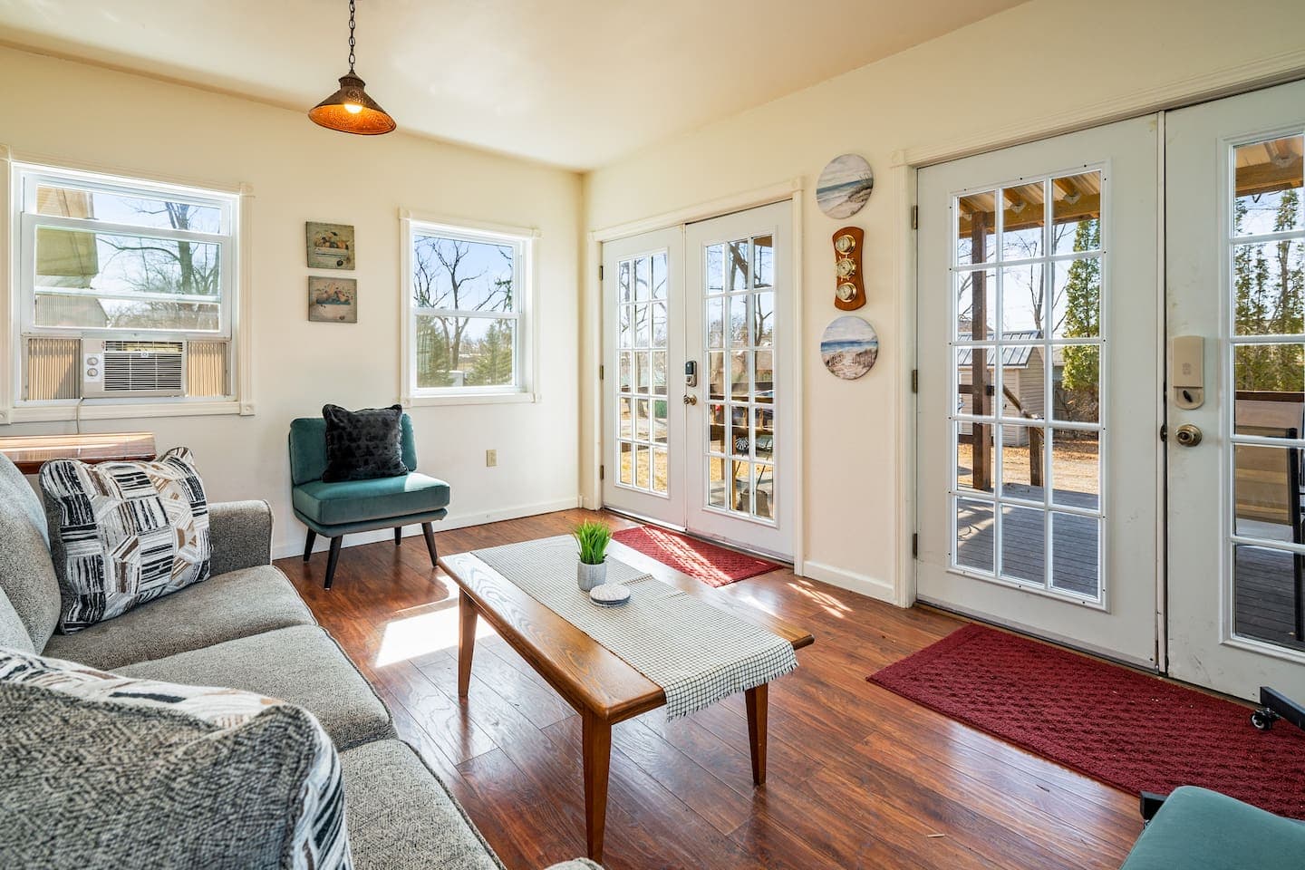 Window-lined sunroom with coffee table
