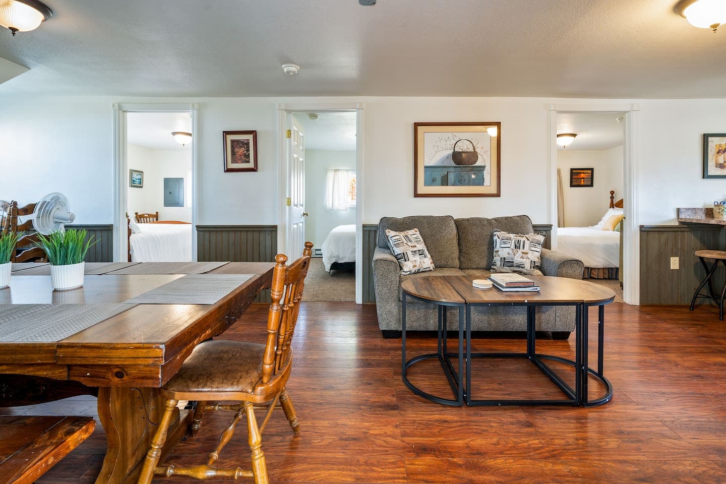 Open living and dining area with hardwood floors