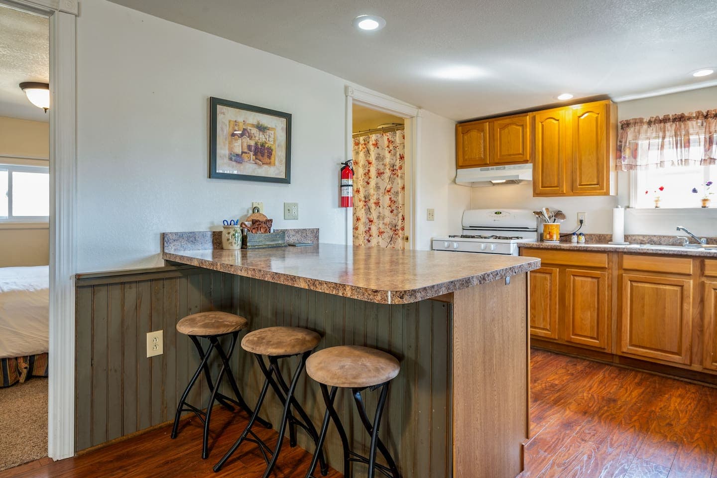 Kitchen breakfast bar with three stools