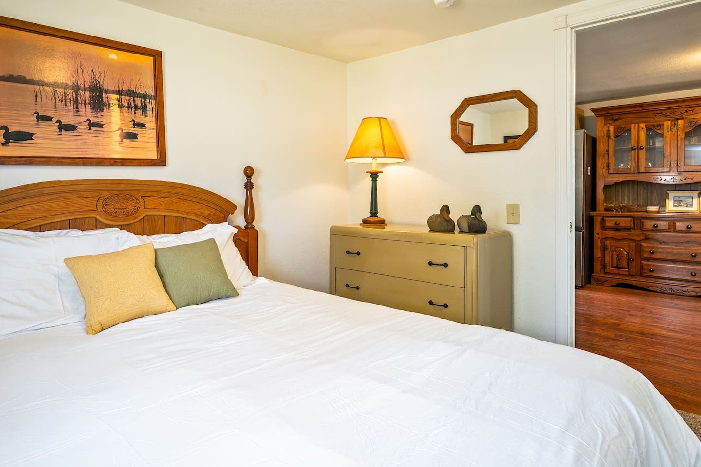 Bed with wooden bed frame and dresser