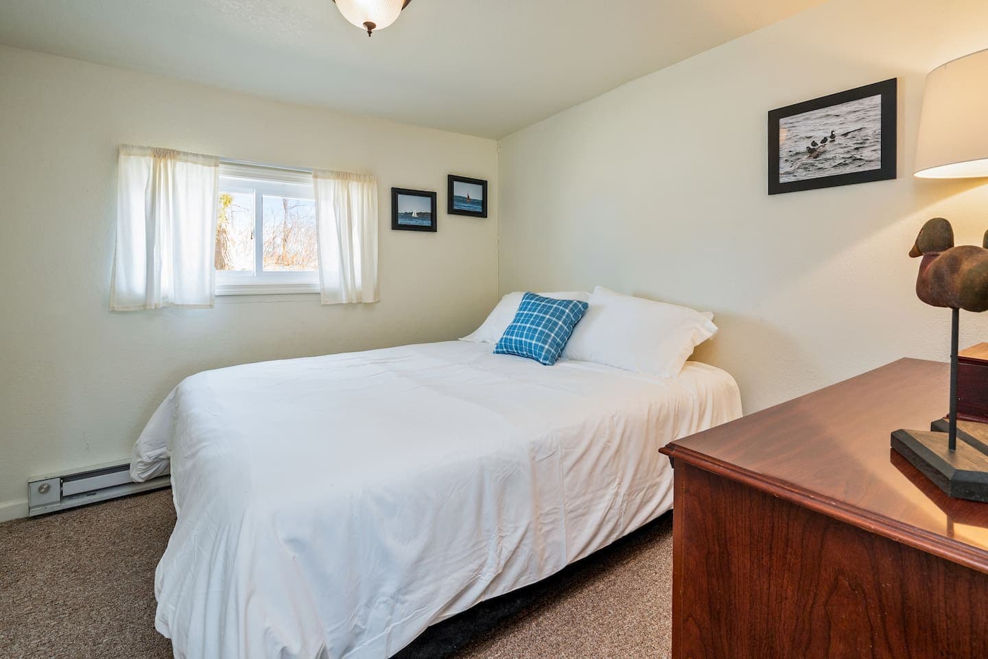Bedroom with twin bed and dresser