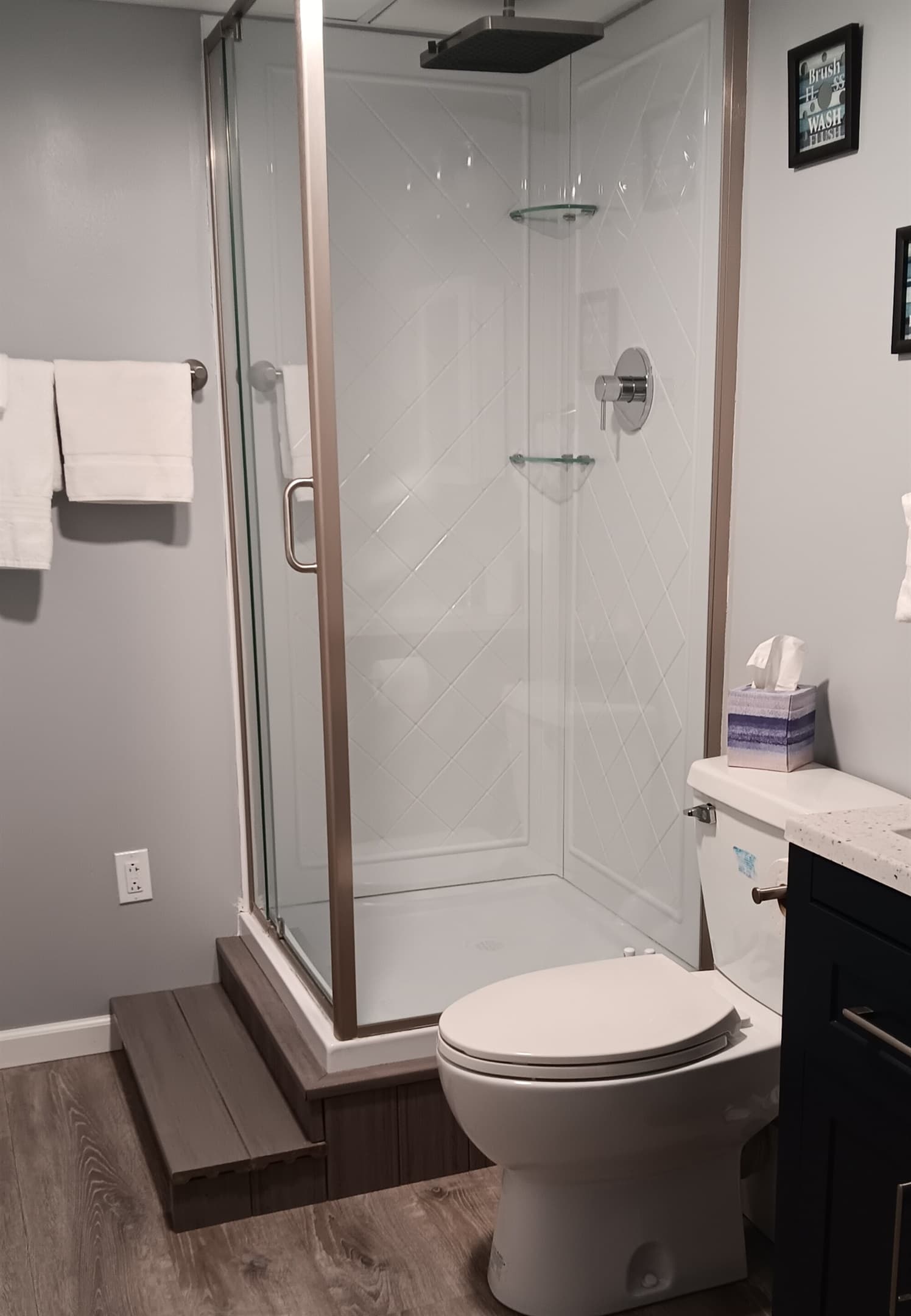Bathroom with glass-enclosed walk-in shower