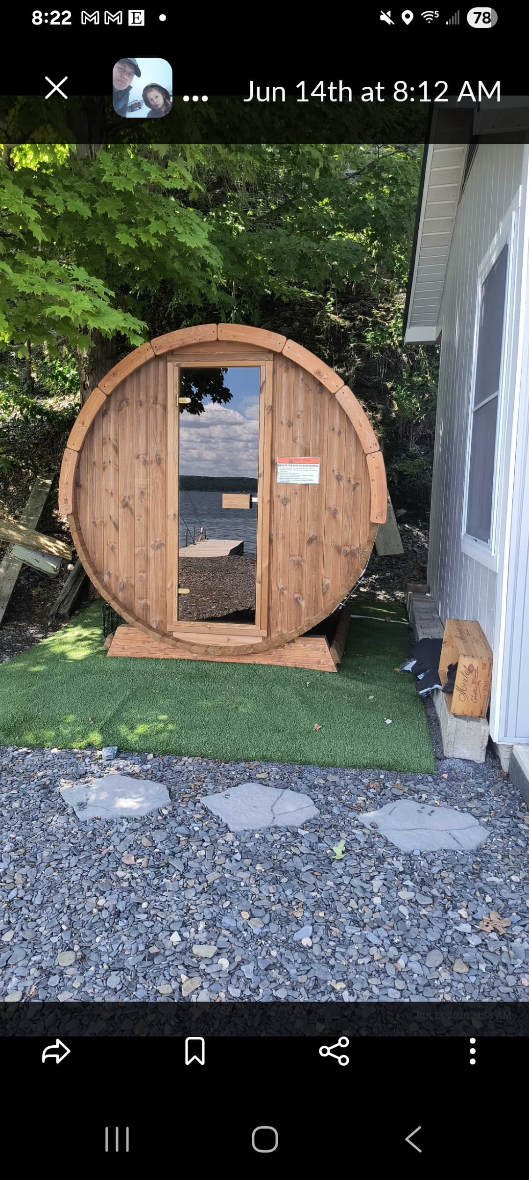 Barrel sauna beside the house