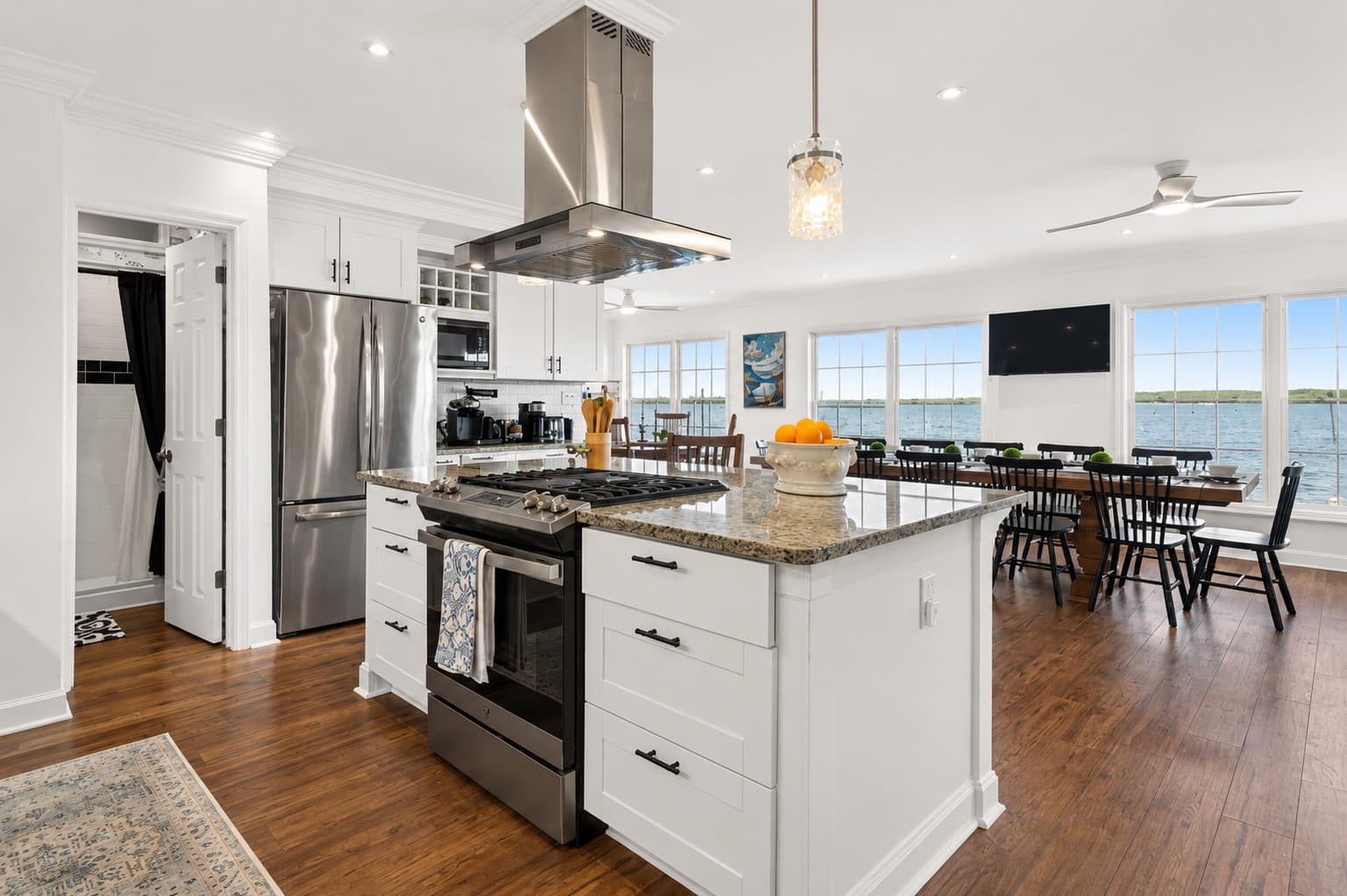 Open kitchen with island and stainless appliances