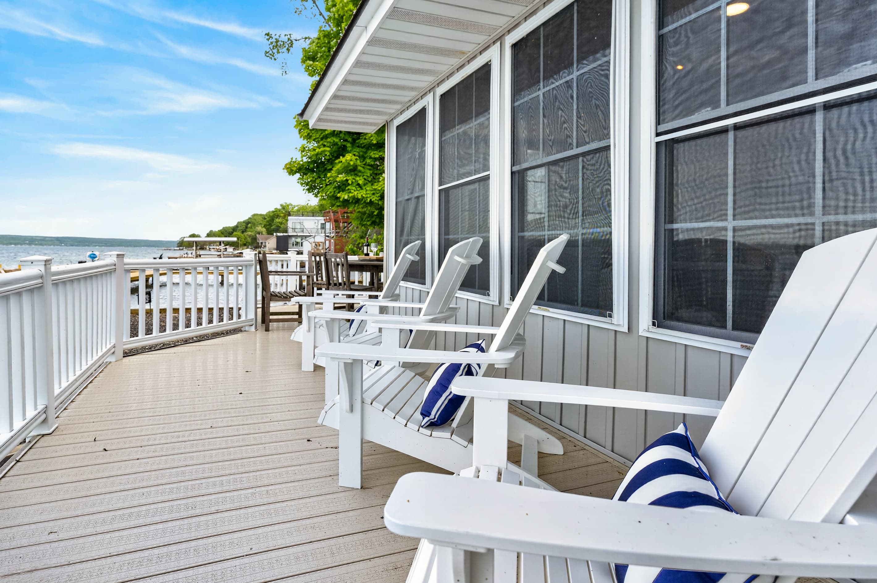 Screened porch with Adirondack chairs
