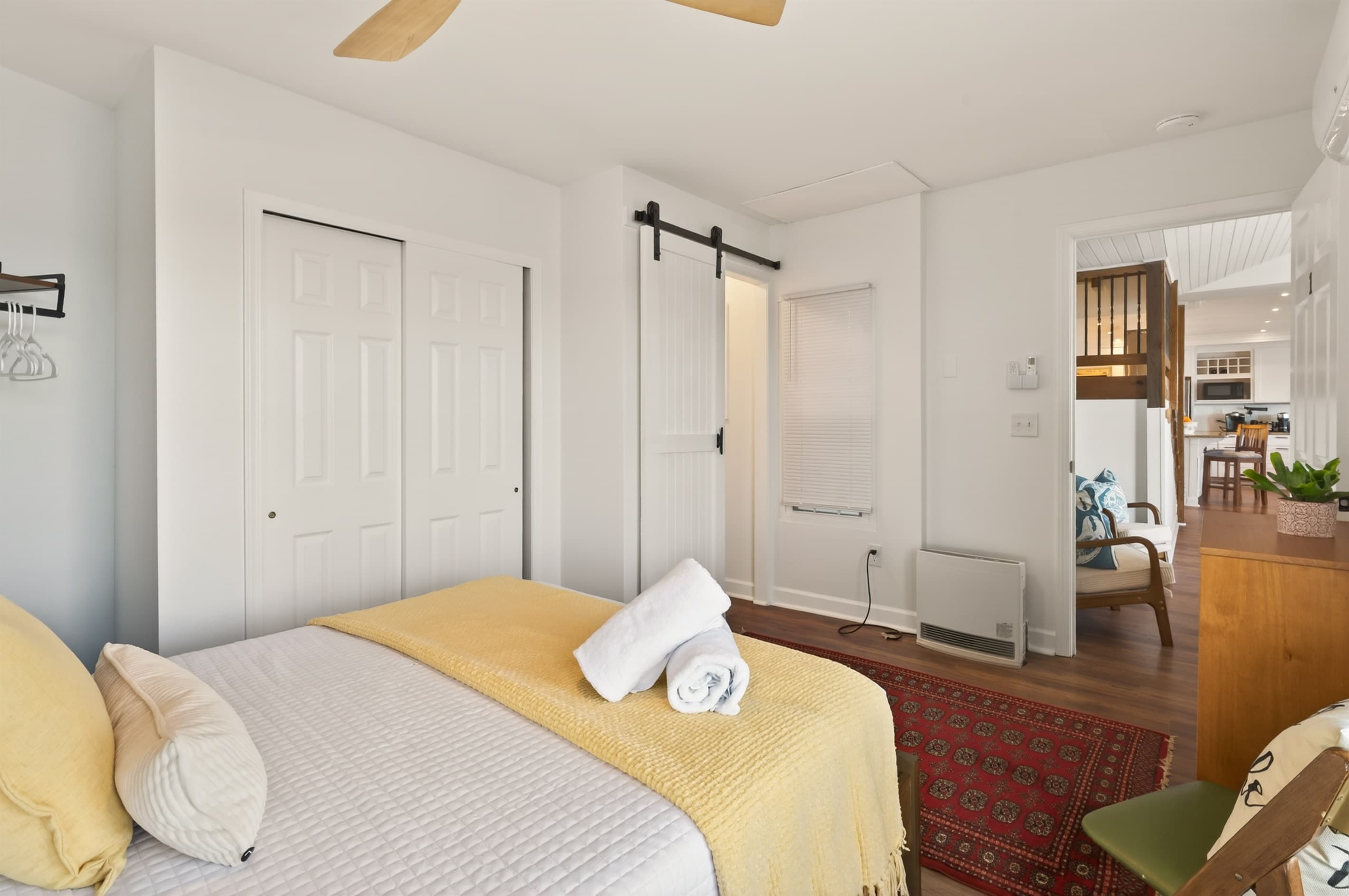 Bedroom with dresser and sliding closet doors