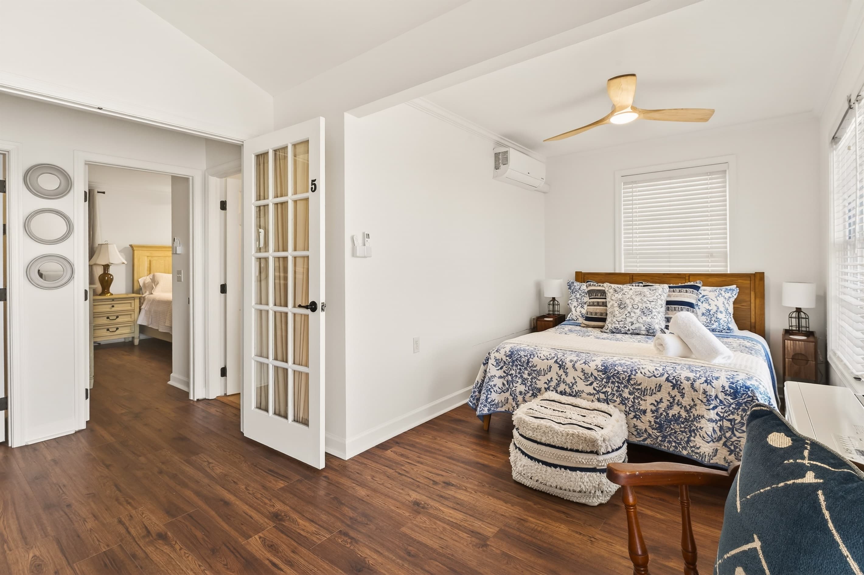 Bedroom with deck access and accent chair