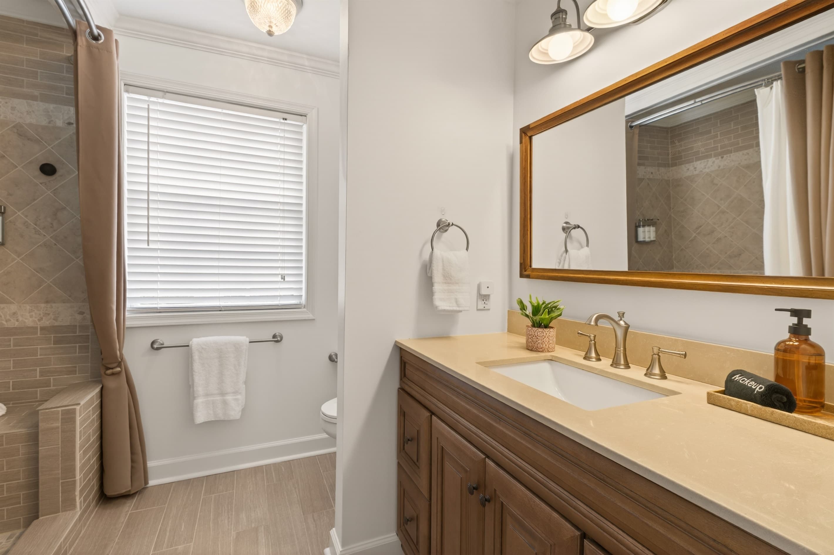 Bathroom vanity with framed mirror