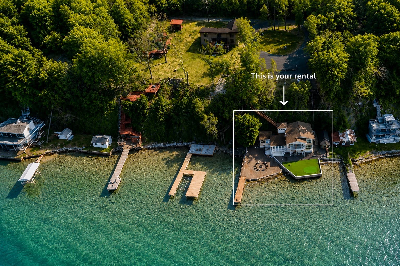 Aerial view showing the rental’s shoreline location