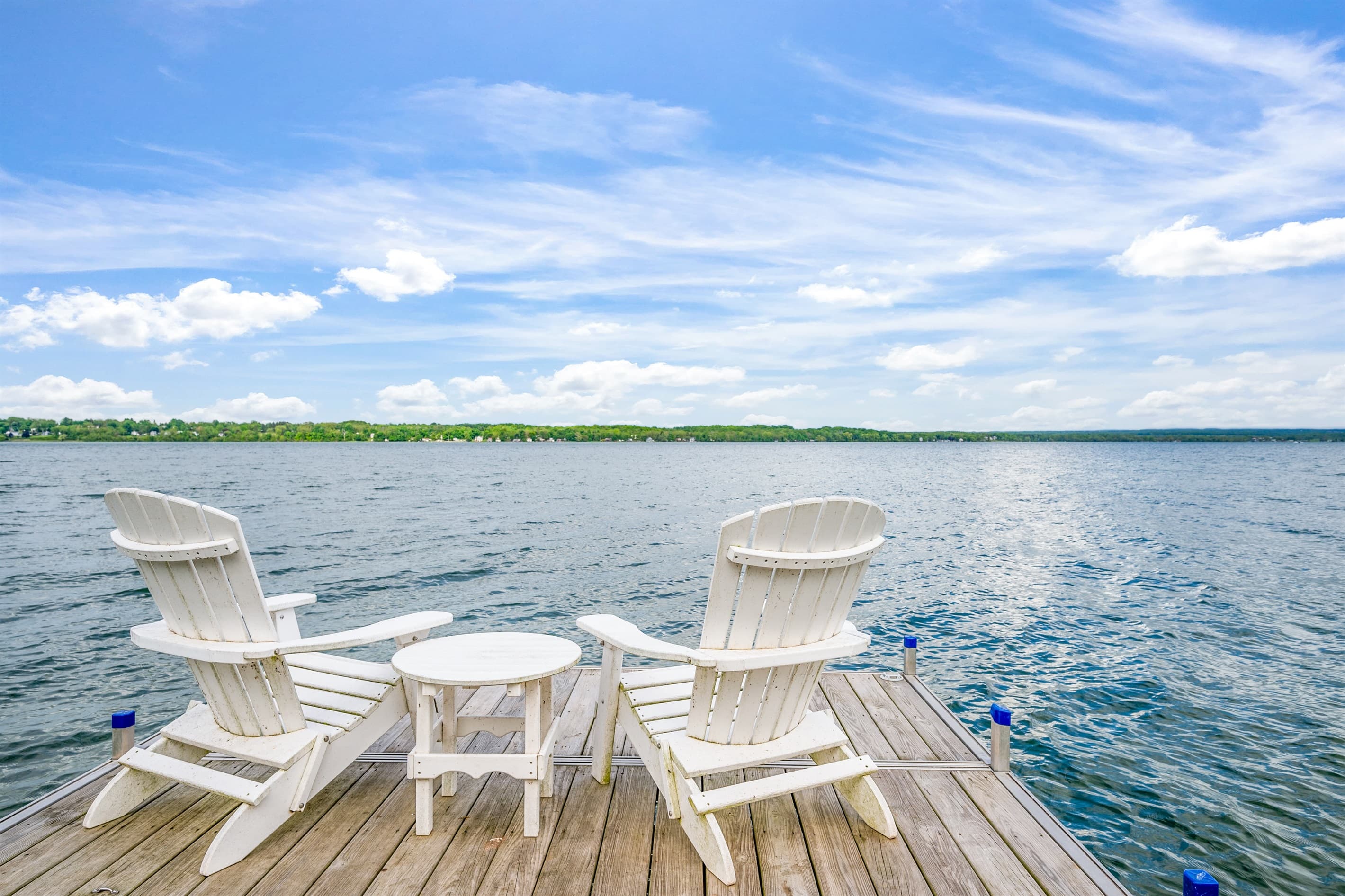 Adirondack chairs facing the lake
