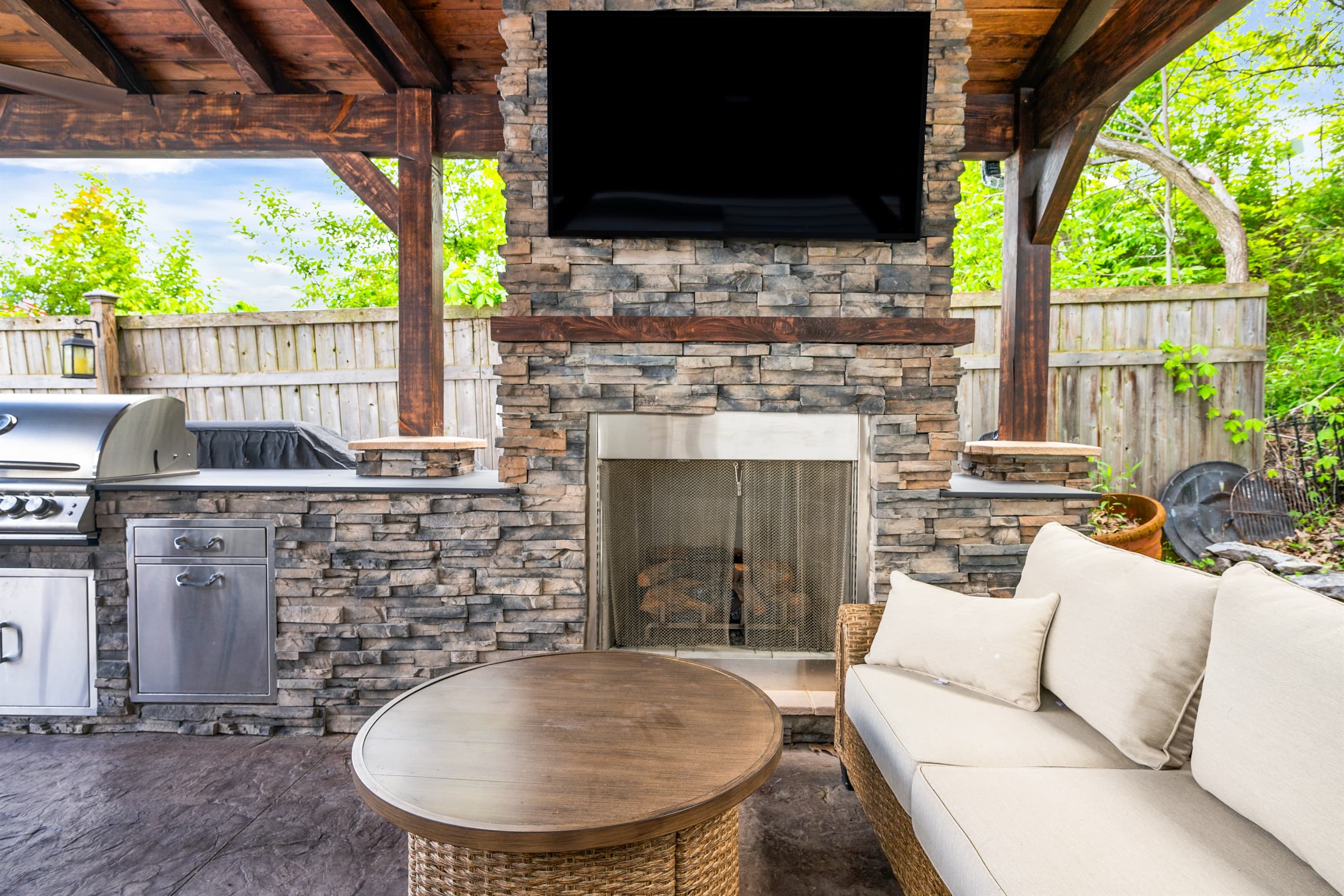 Stone fireplace under the covered pavilion