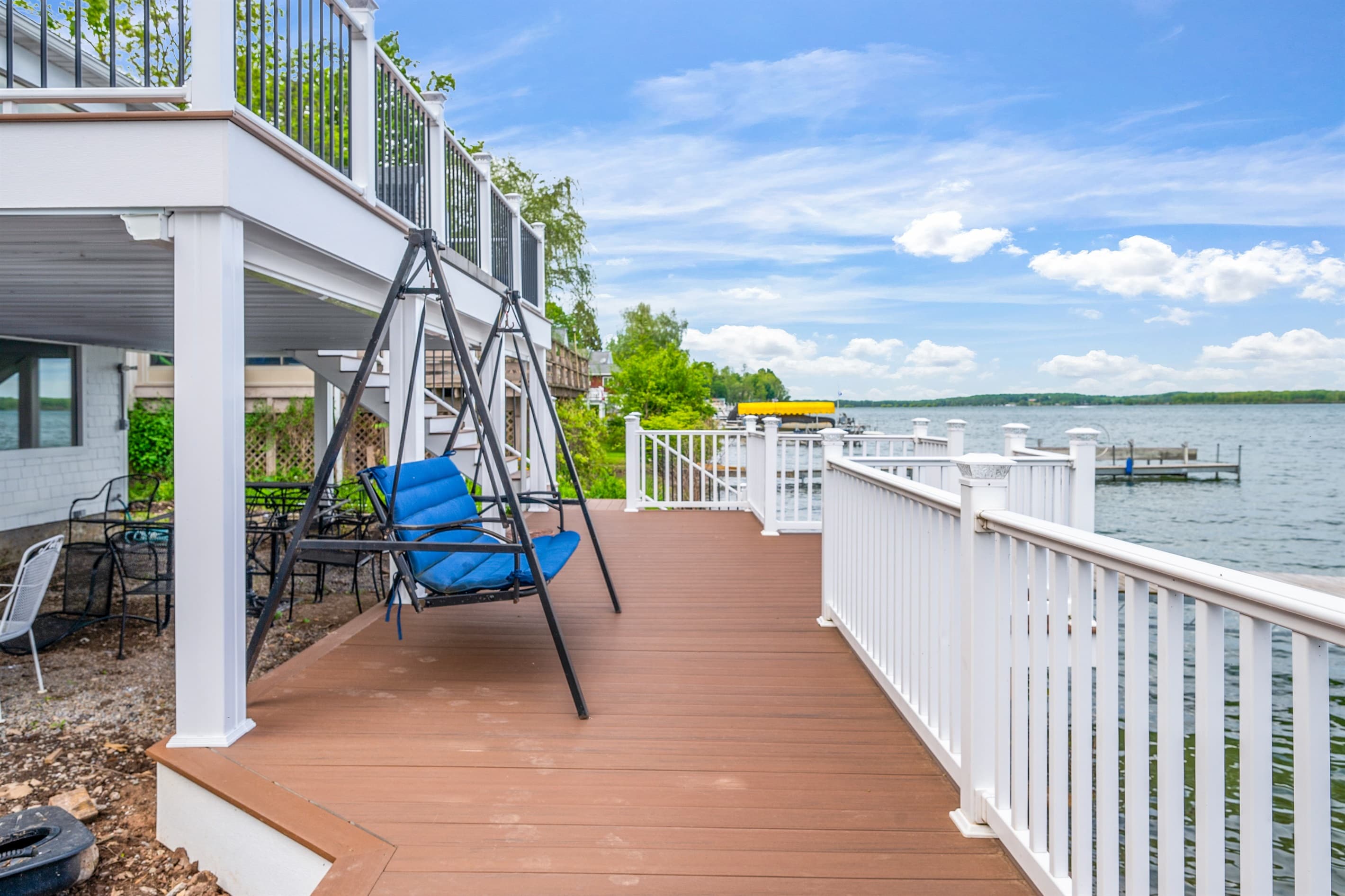 Waterfront deck with suspended swing