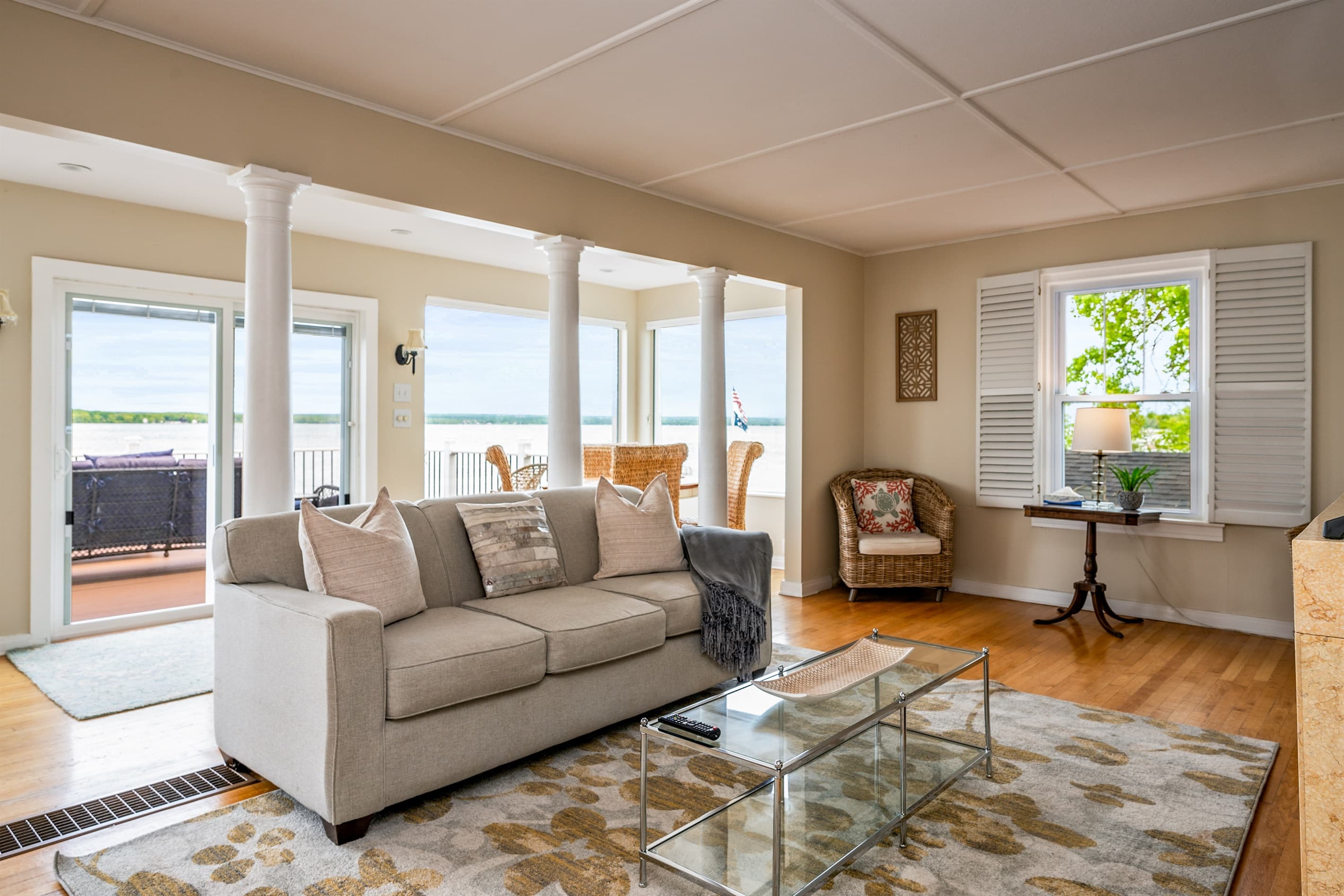 Living room surrounded by lake-facing windows
