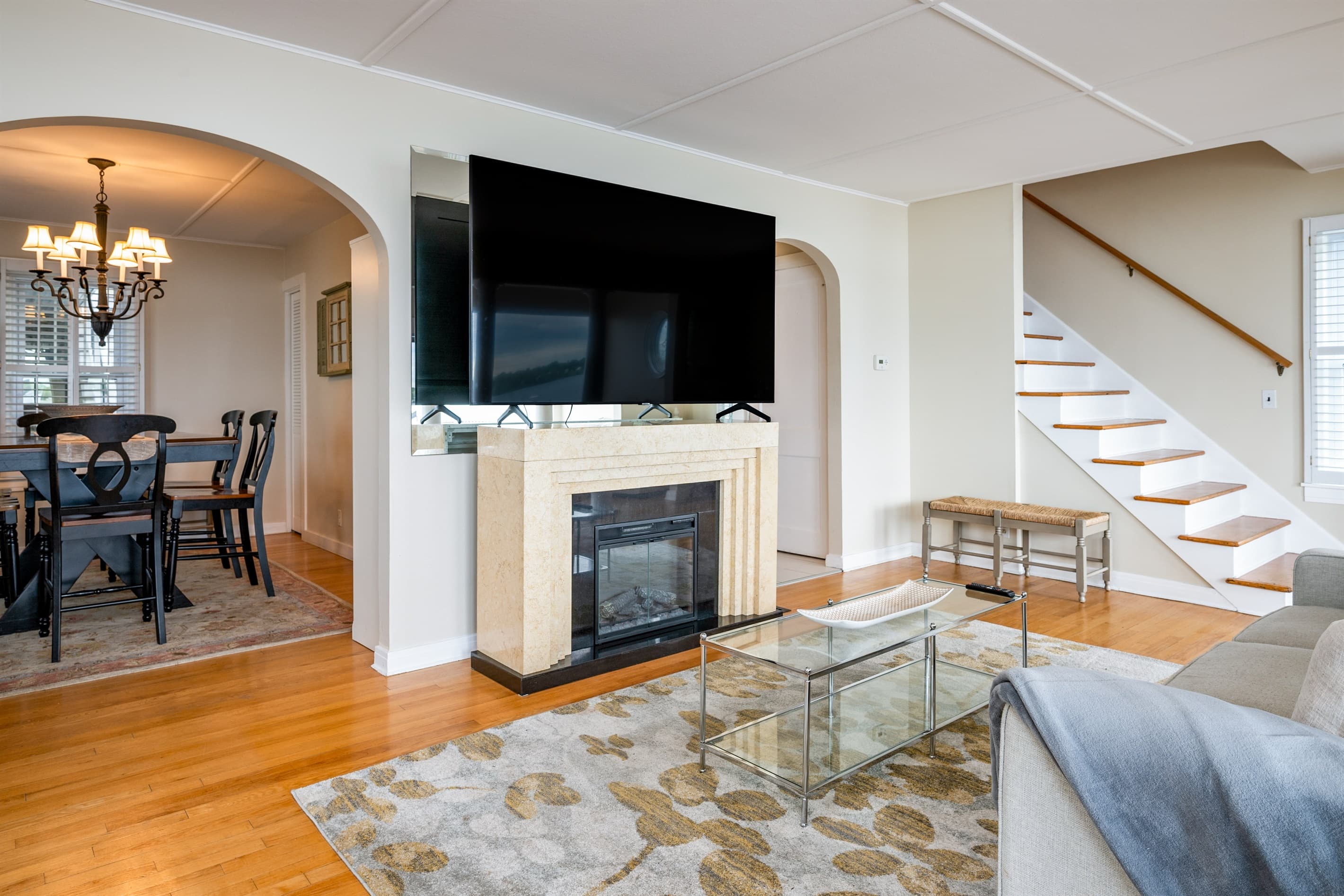 Fireplace and television beside the staircase