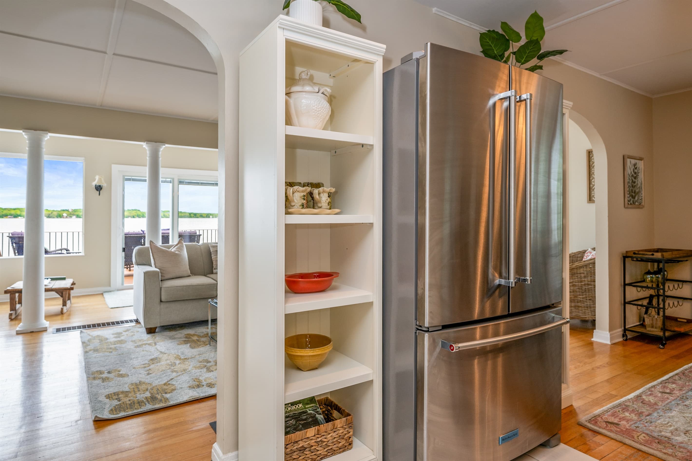 Kitchen refrigerator beside open living space