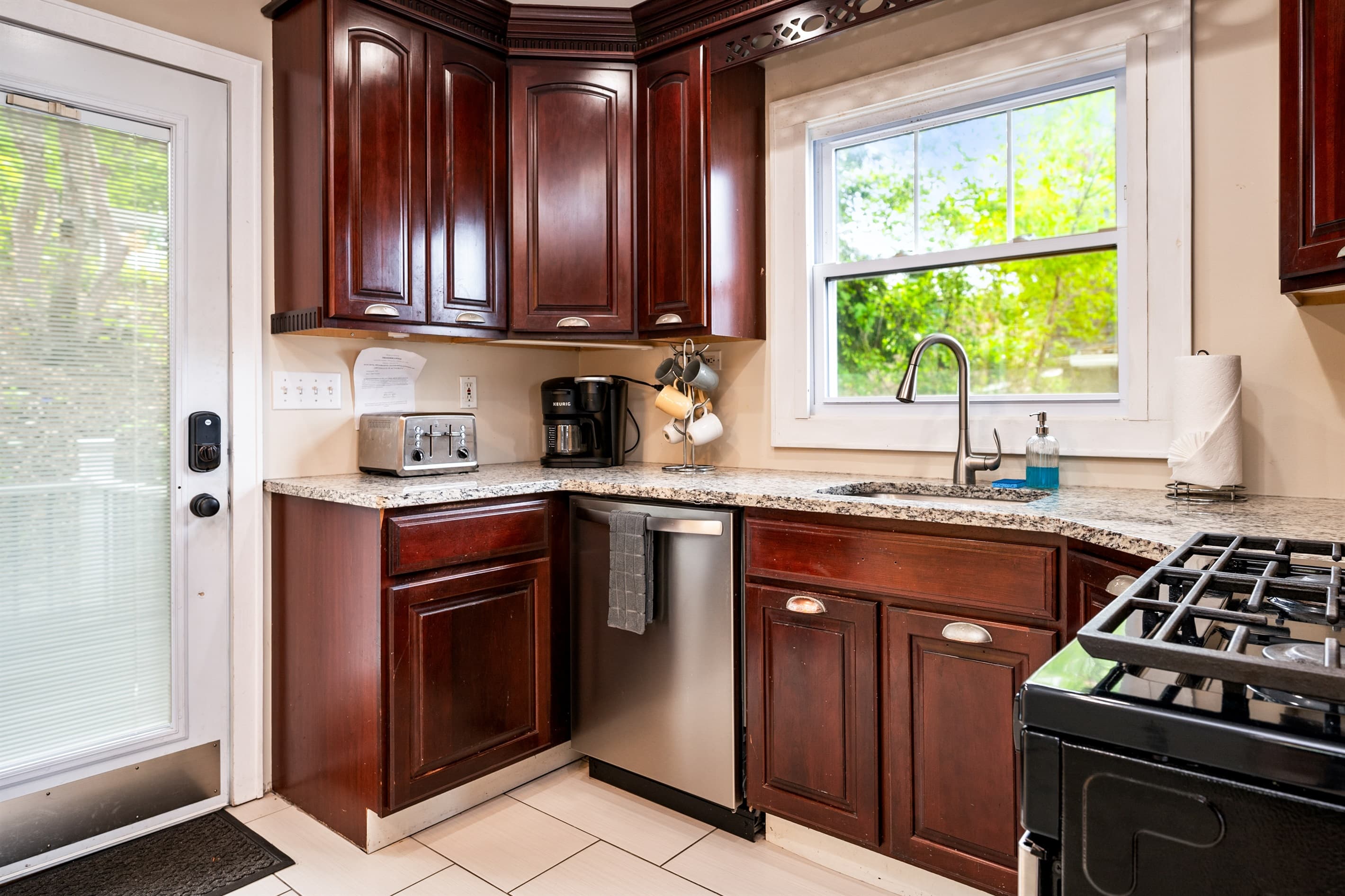 Kitchen sink beneath a garden-facing window