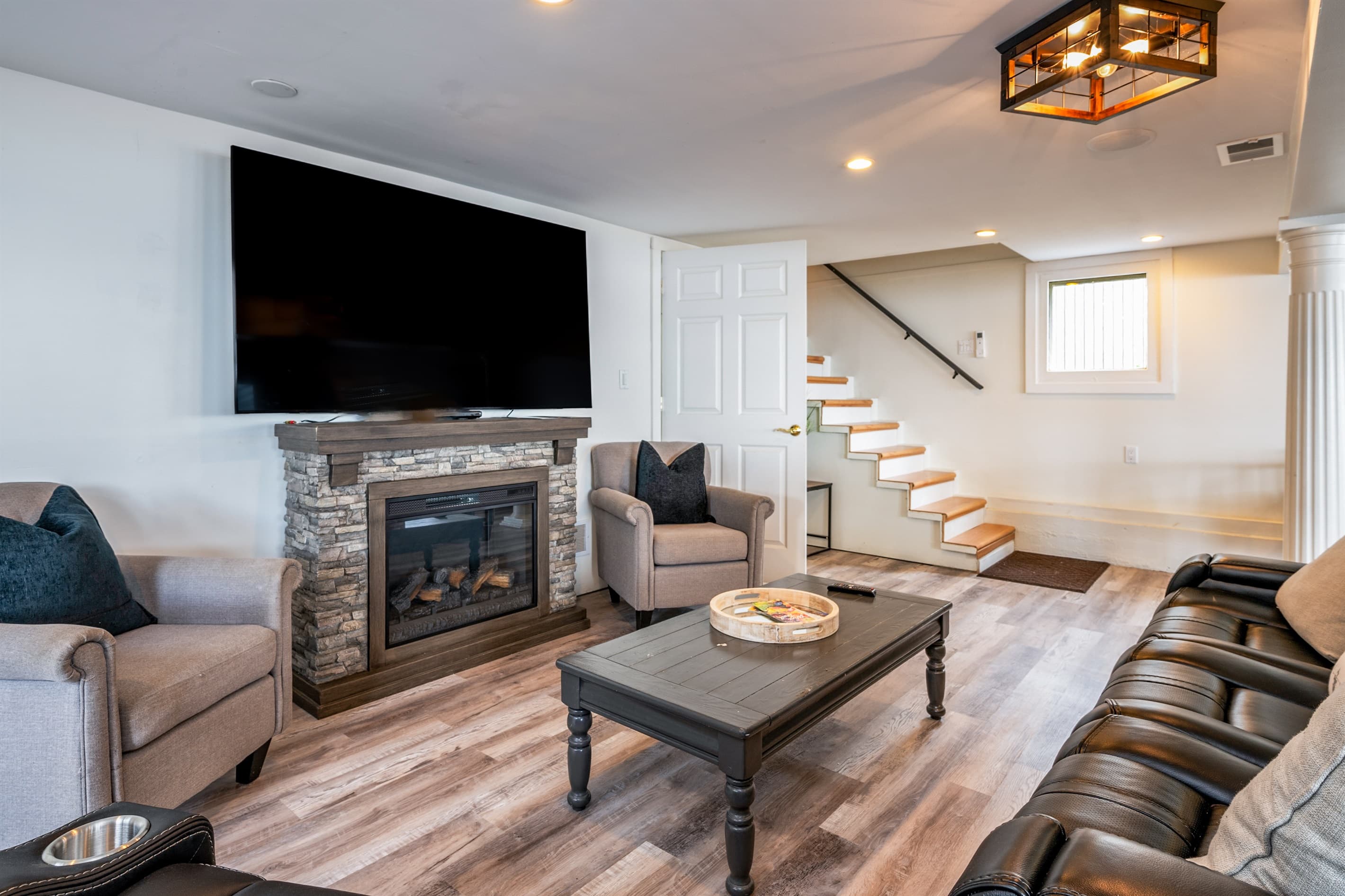 Living room fireplace beside the staircase