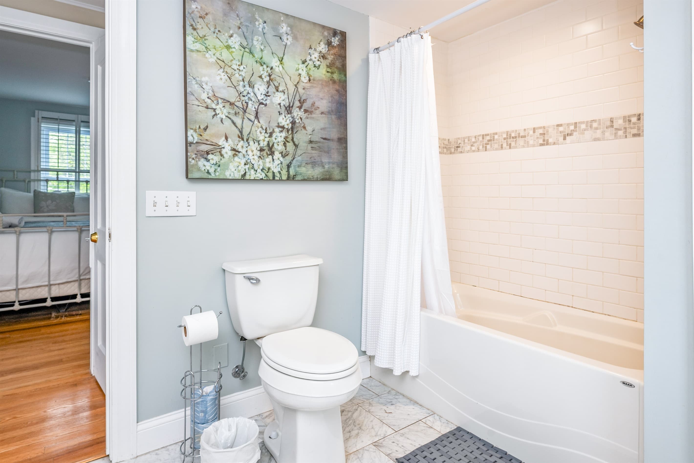 Bathroom with soaking tub and toilet
