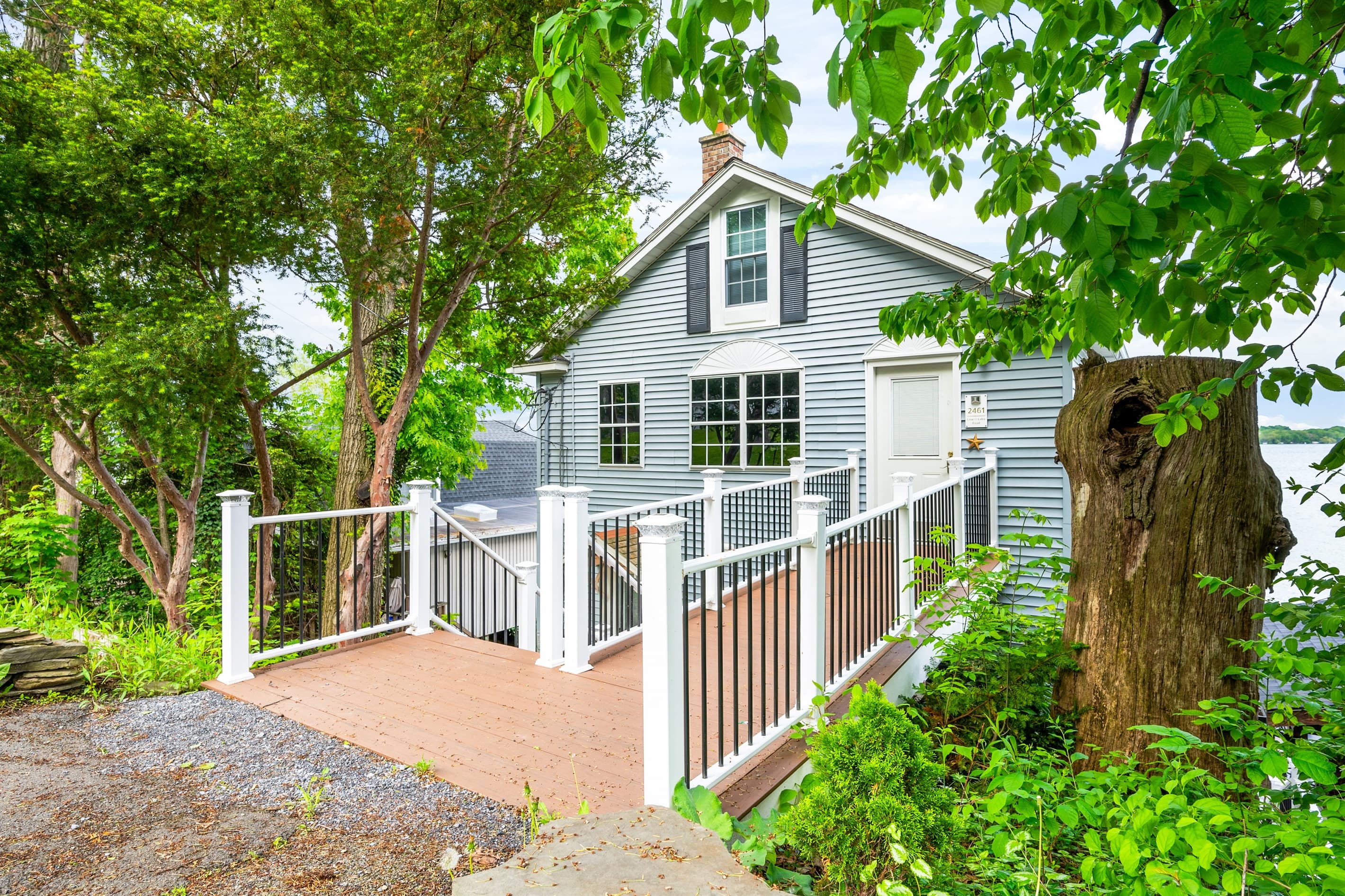 Lakeside side yard beneath mature trees