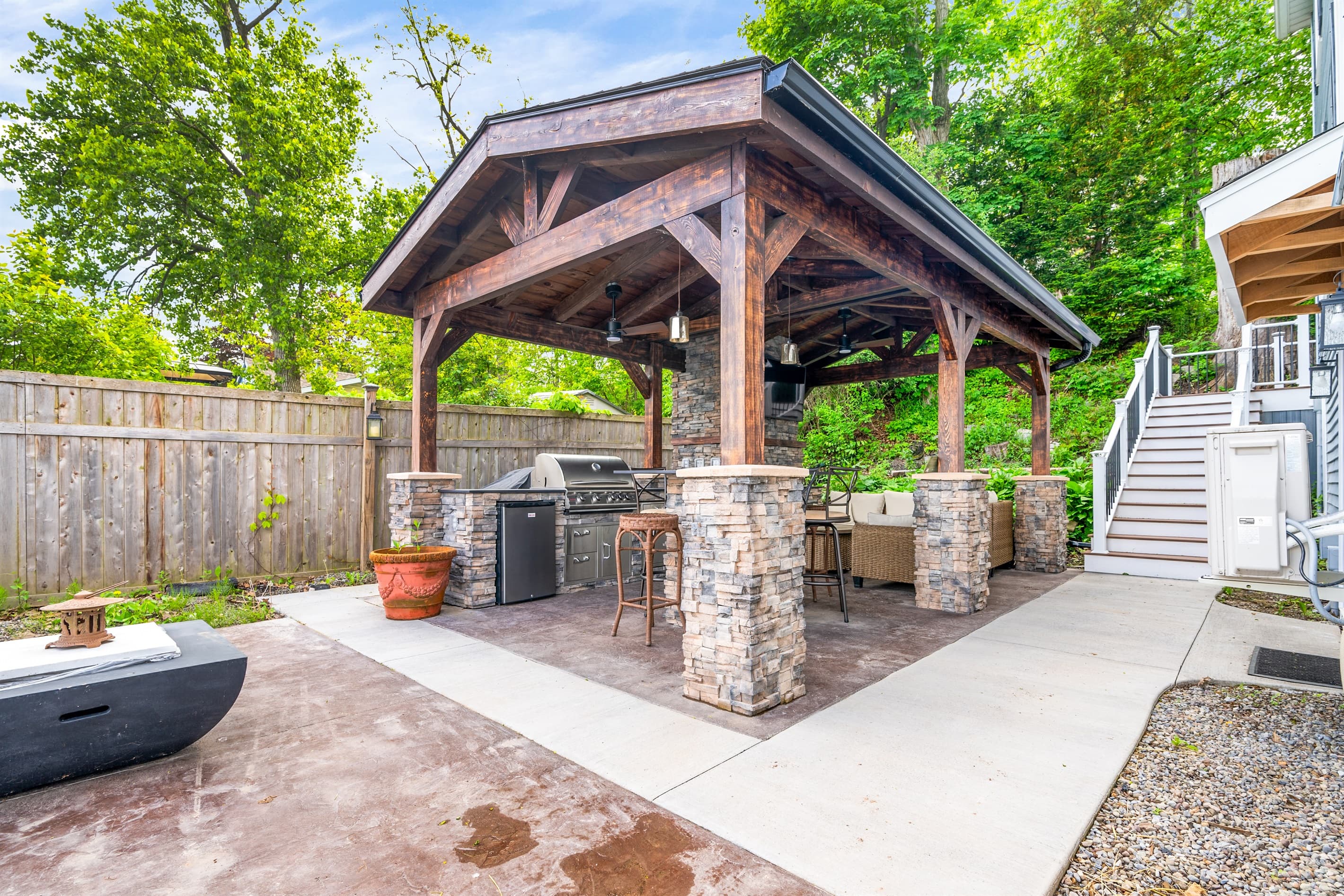 Pavilion with stone fireplace and dining area