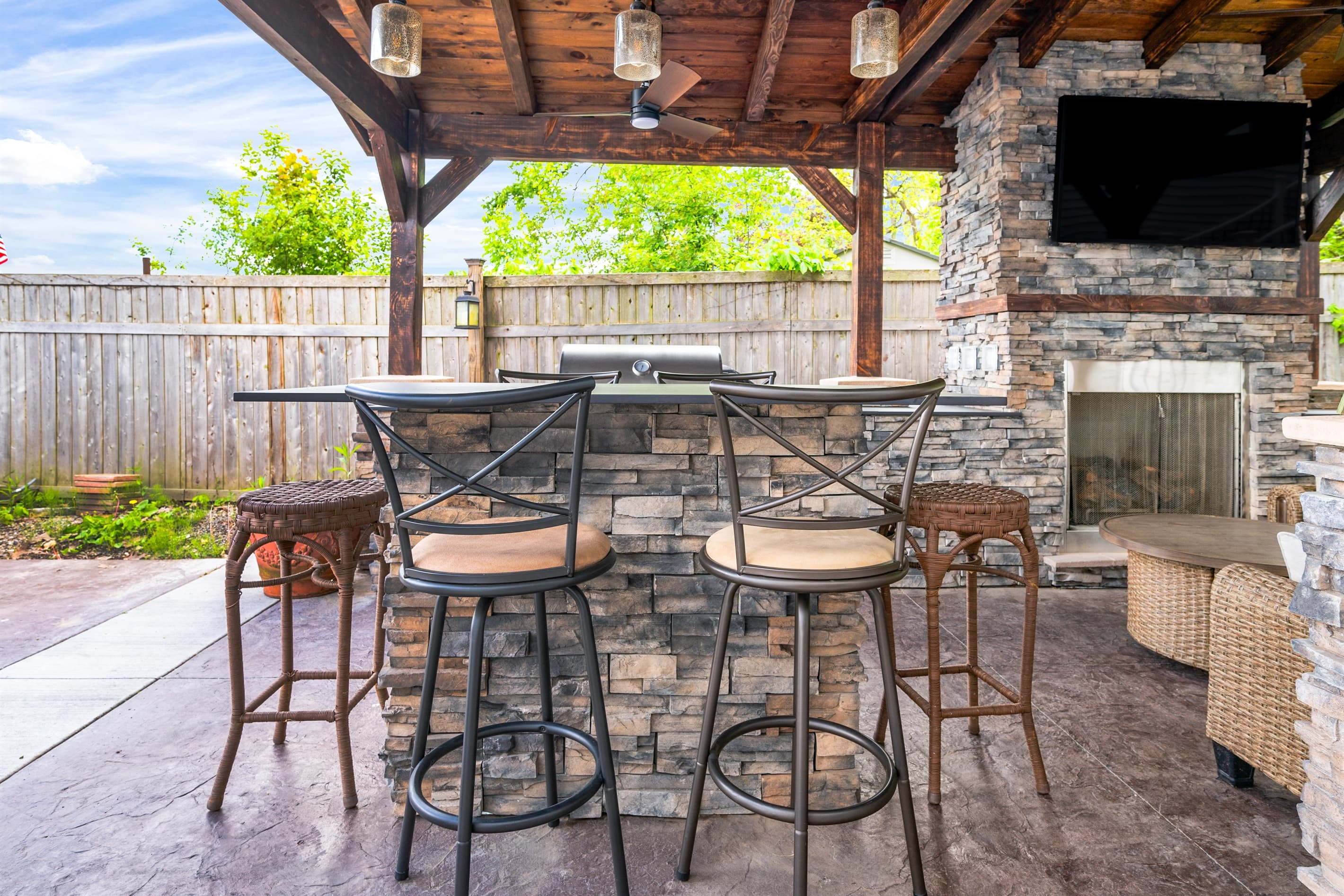 Covered patio table beside built-in counters
