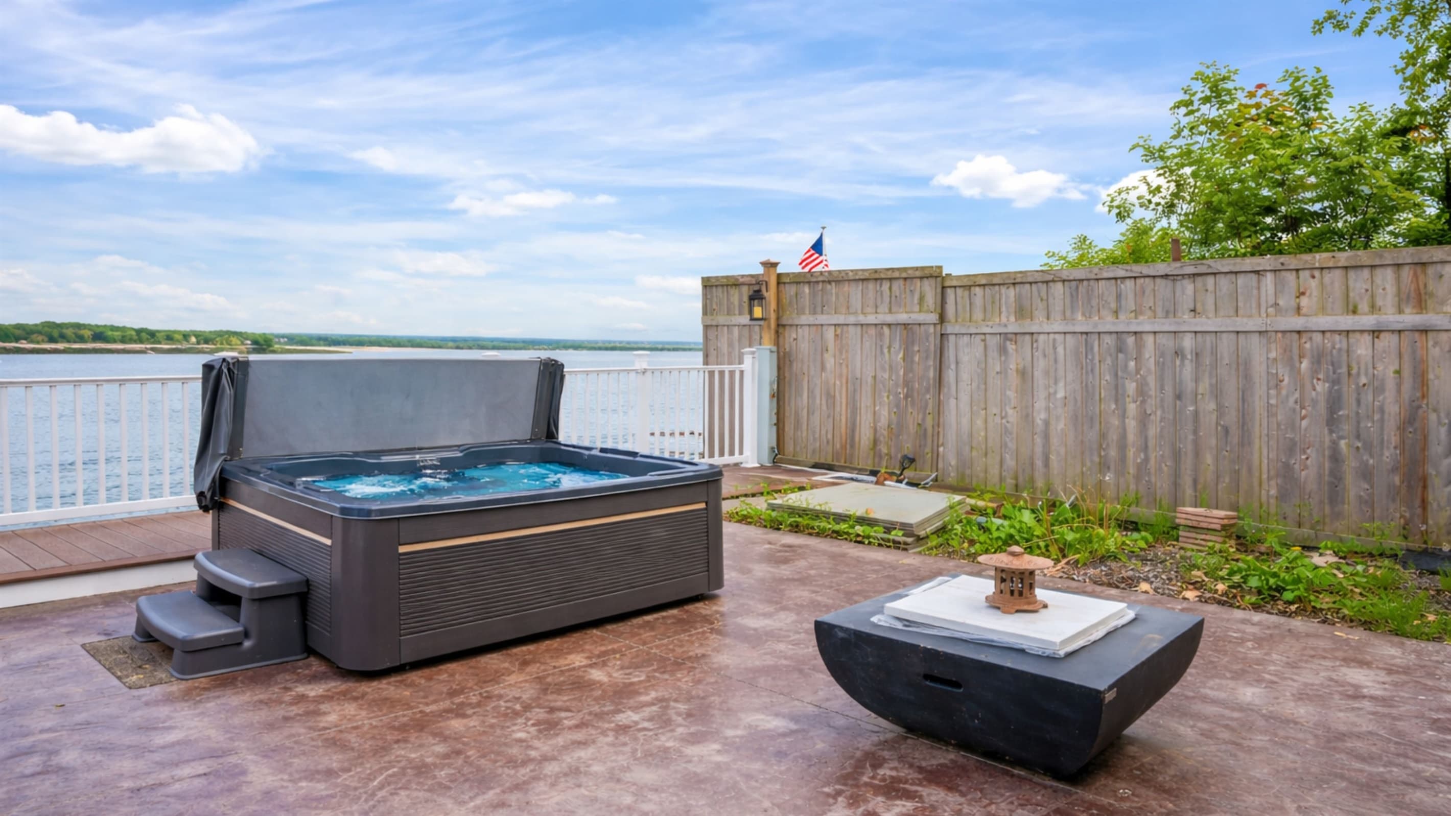 Hot tub within a fenced deck