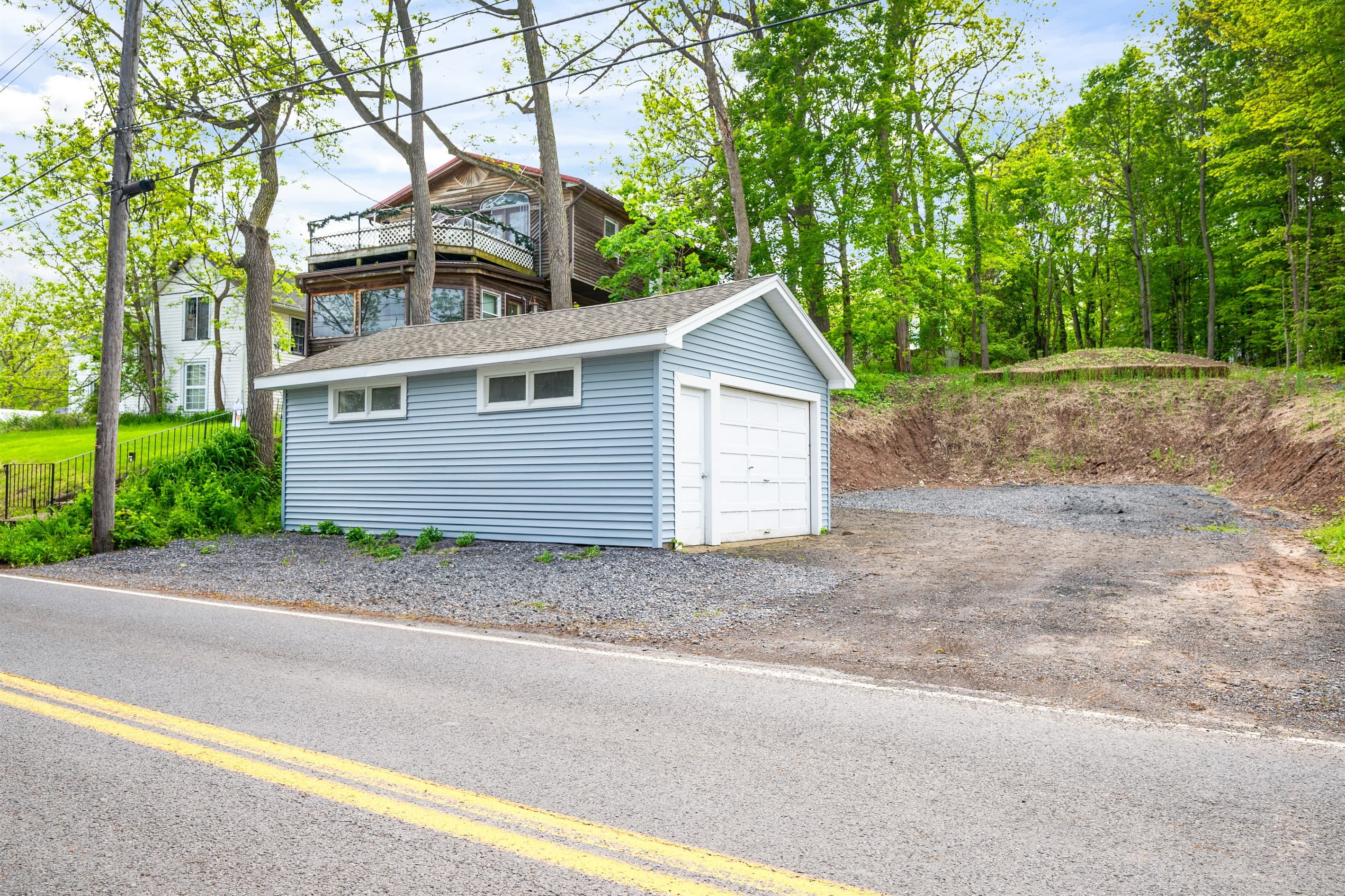 Detached garage beside the parking area