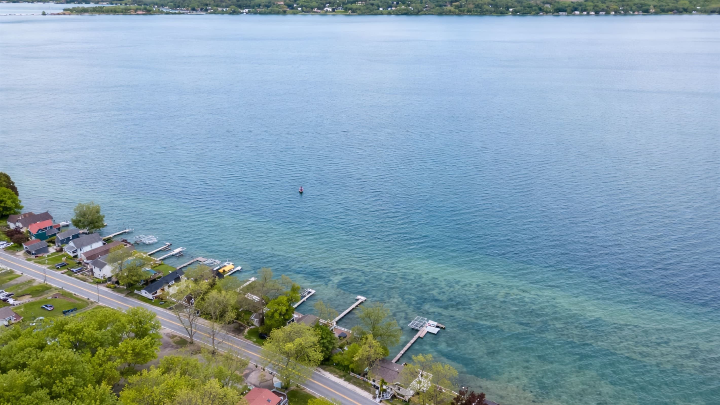 Lake and distant shoreline panorama