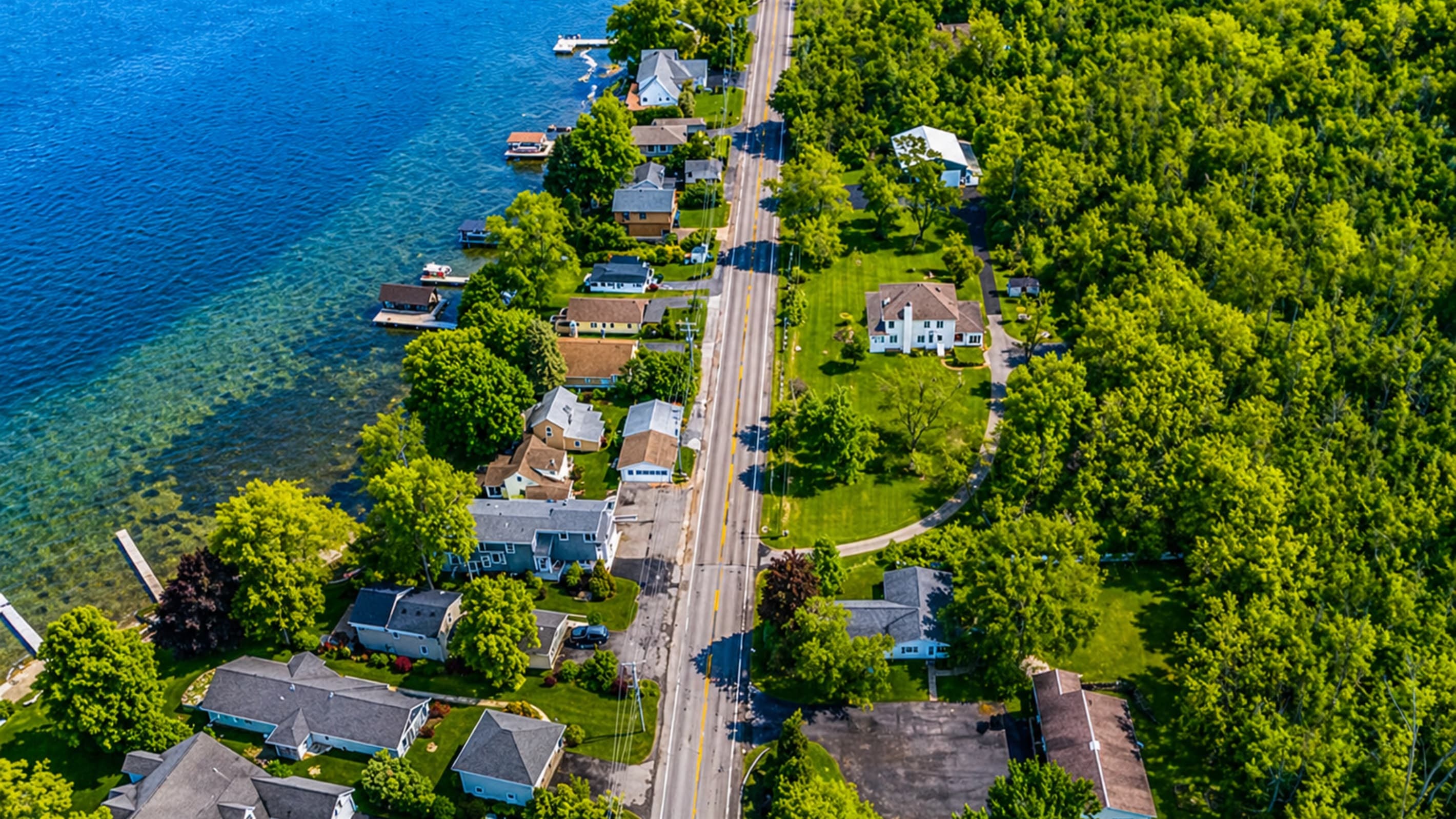 Aerial view of waterfront neighborhood and road