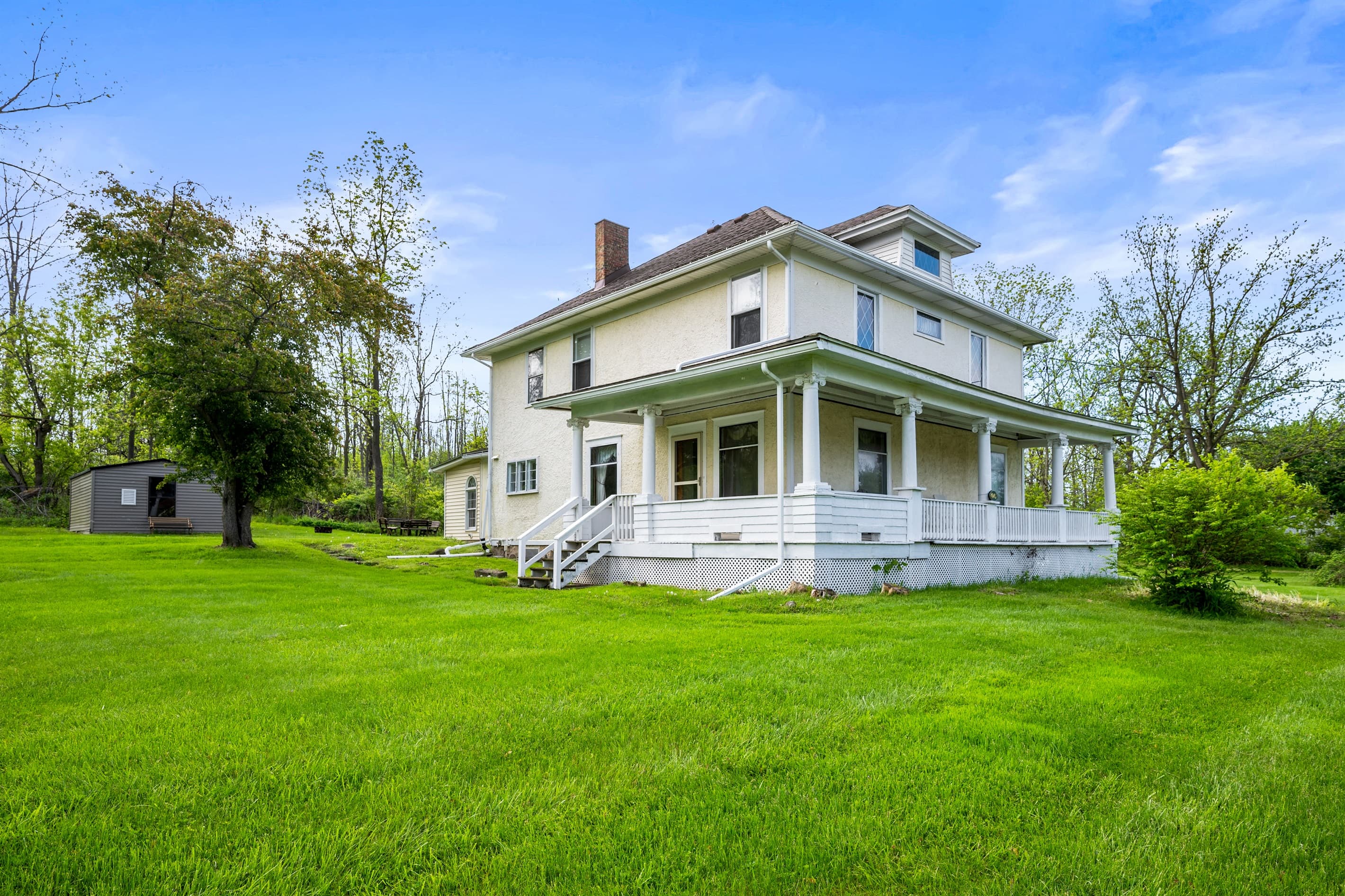 Side exterior viewed across the lawn