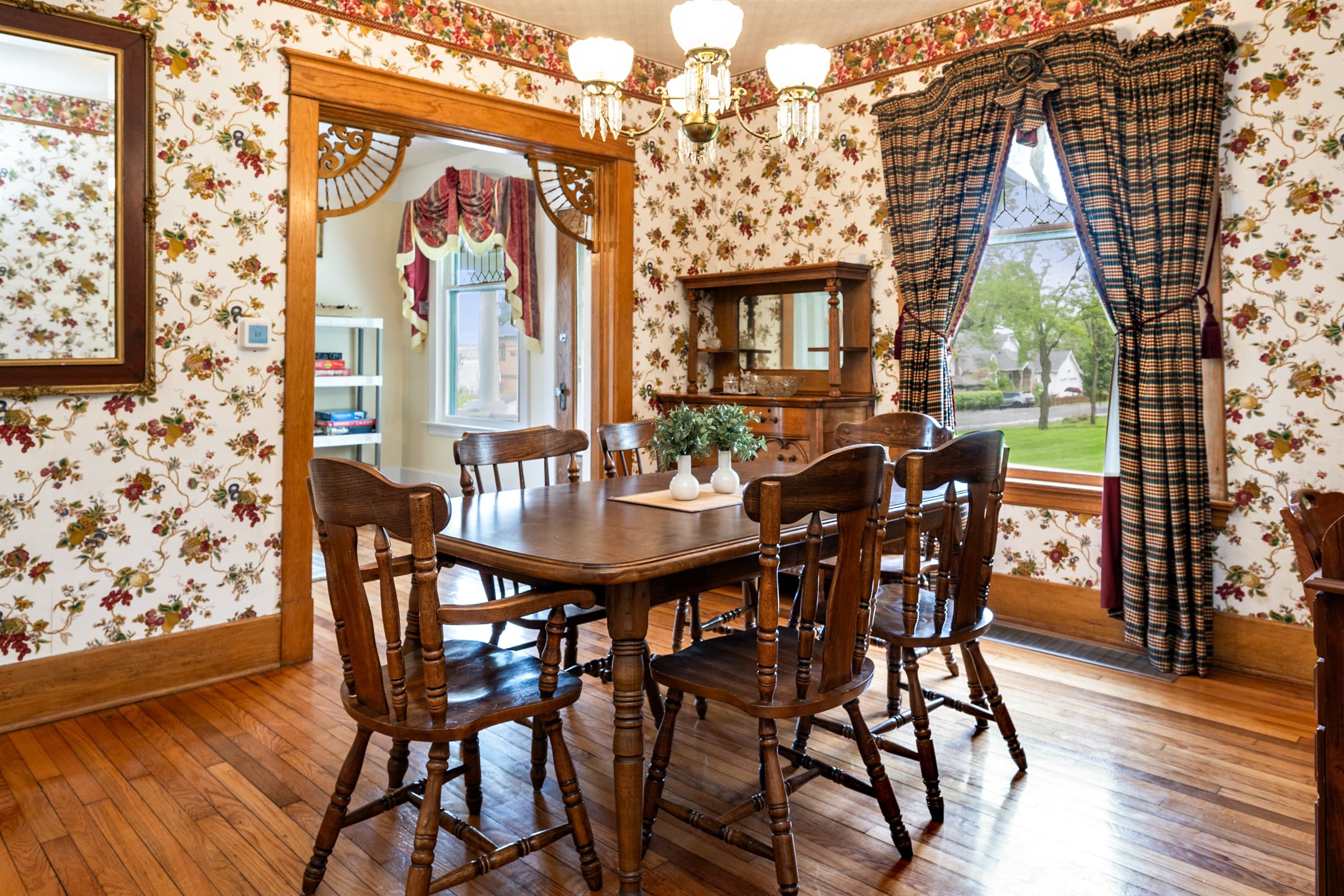 Dining table beside garden-facing windows
