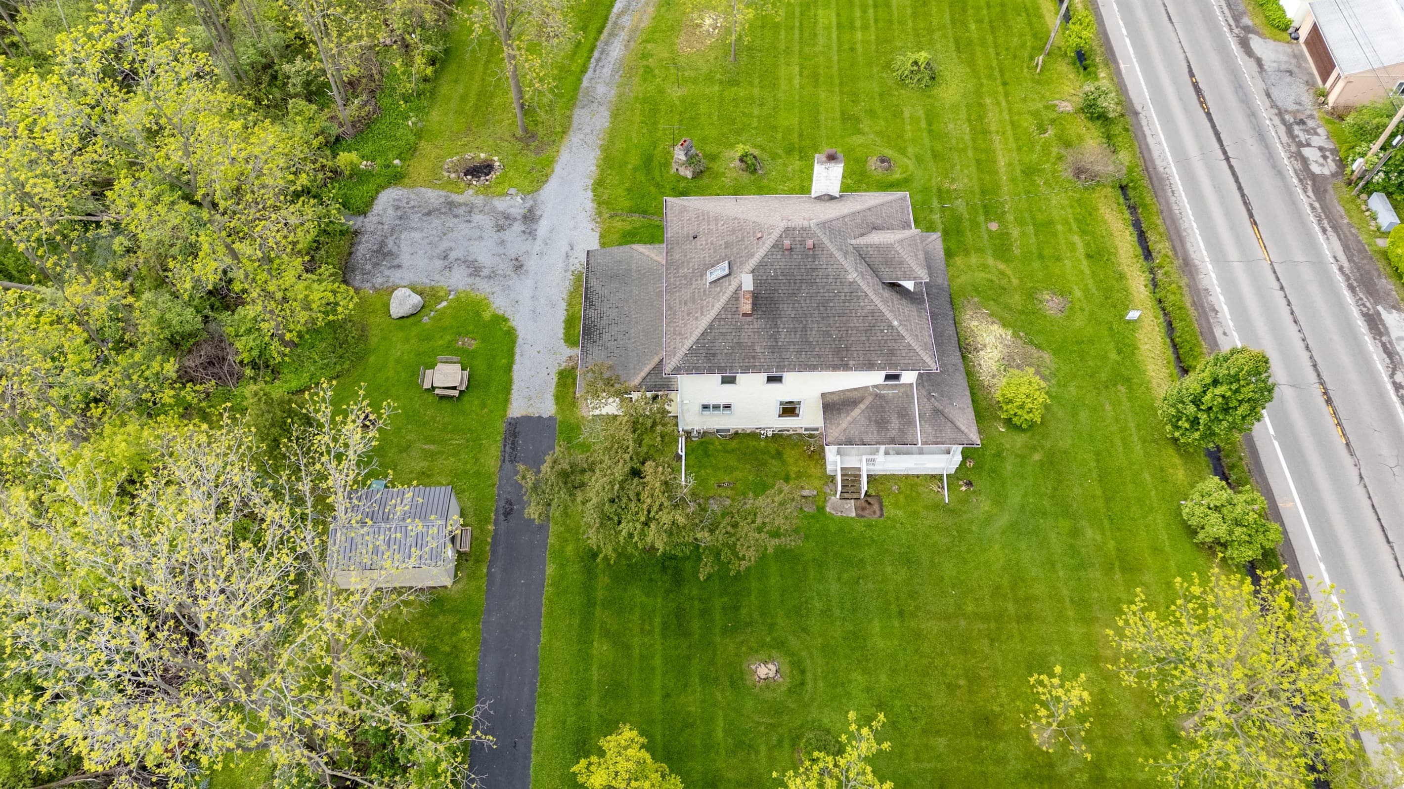 Aerial view of house and curved driveway