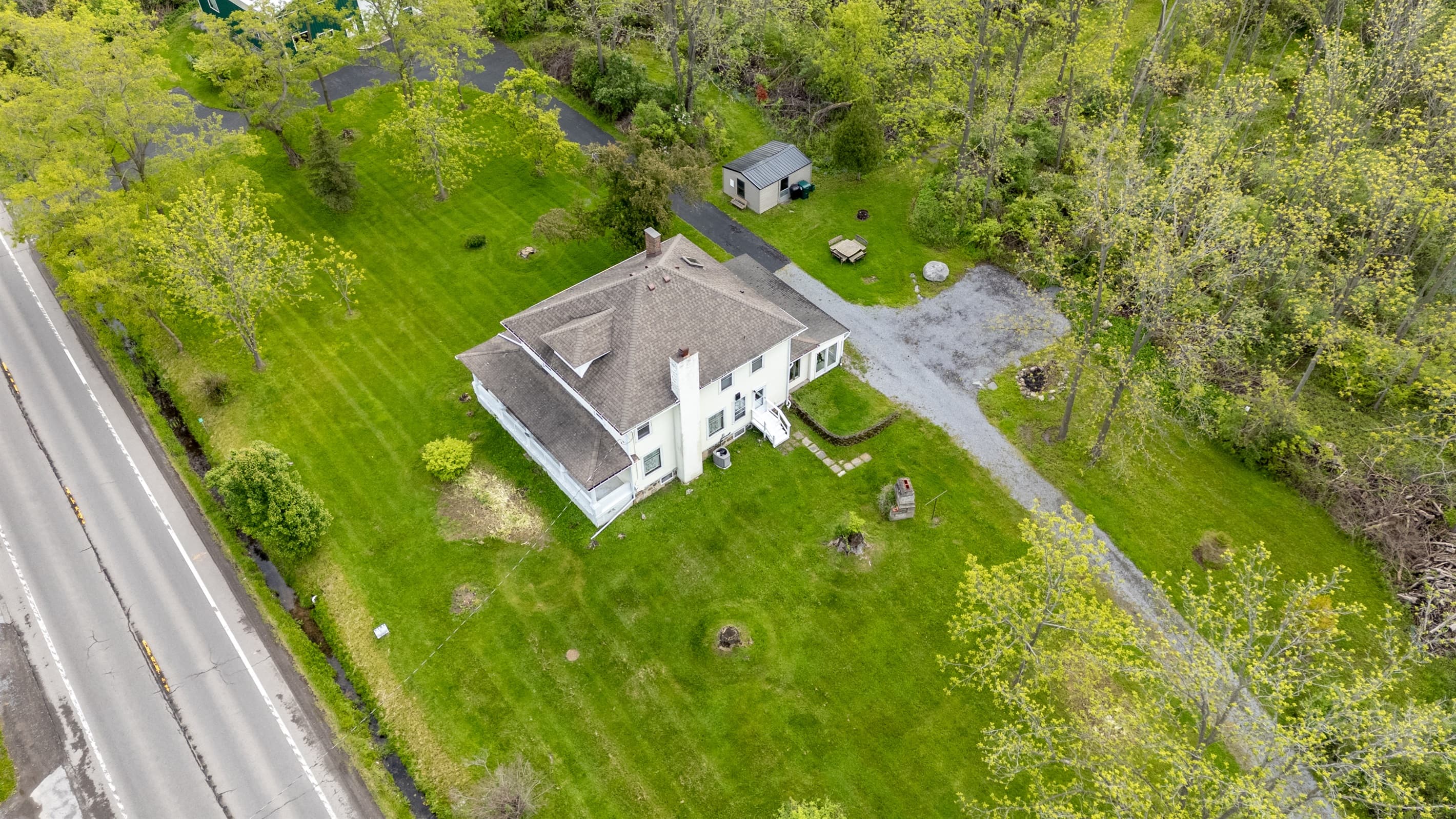 Overhead property view with surrounding grassland