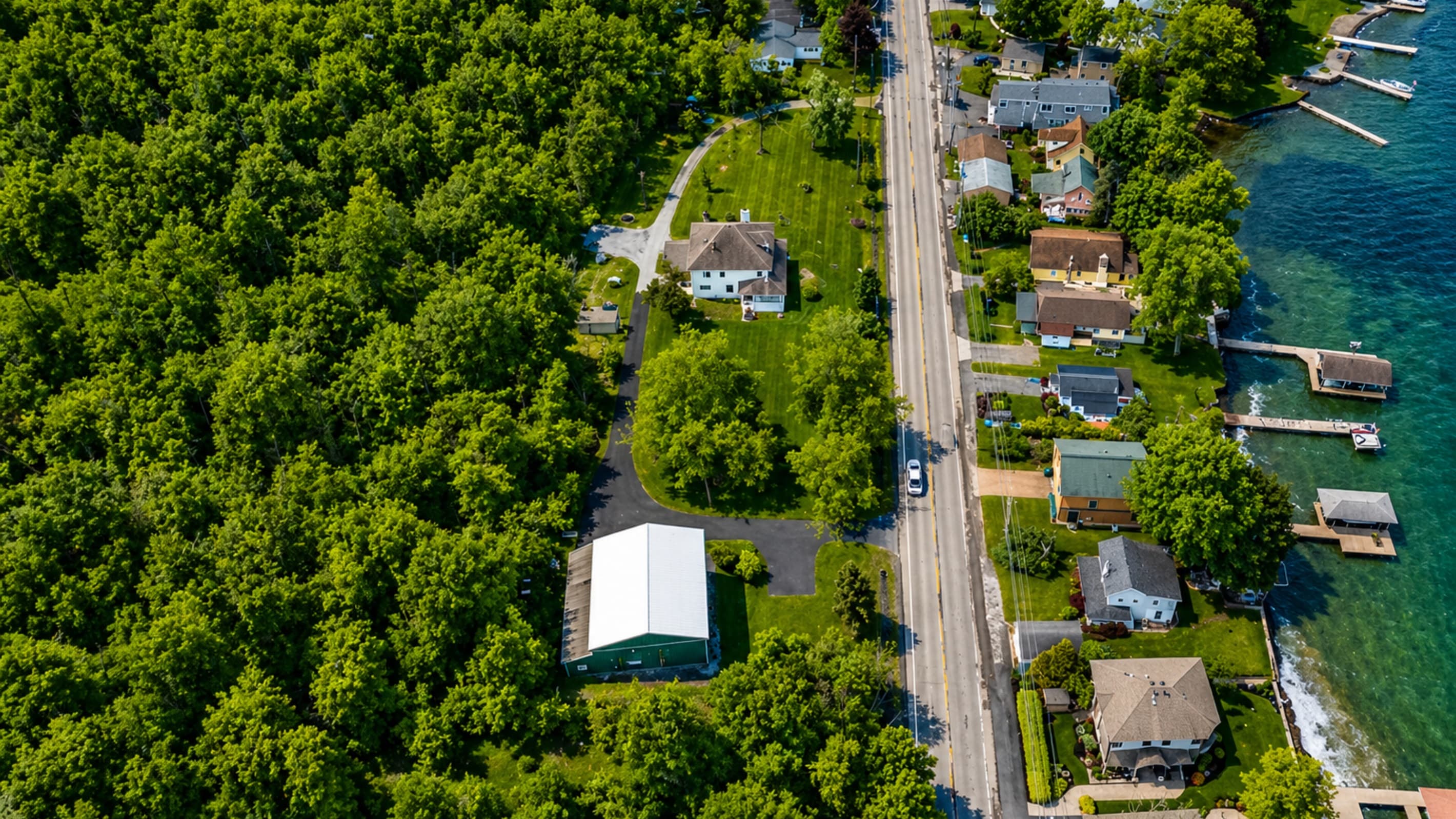 Overhead view of house, driveway, and outbuilding
