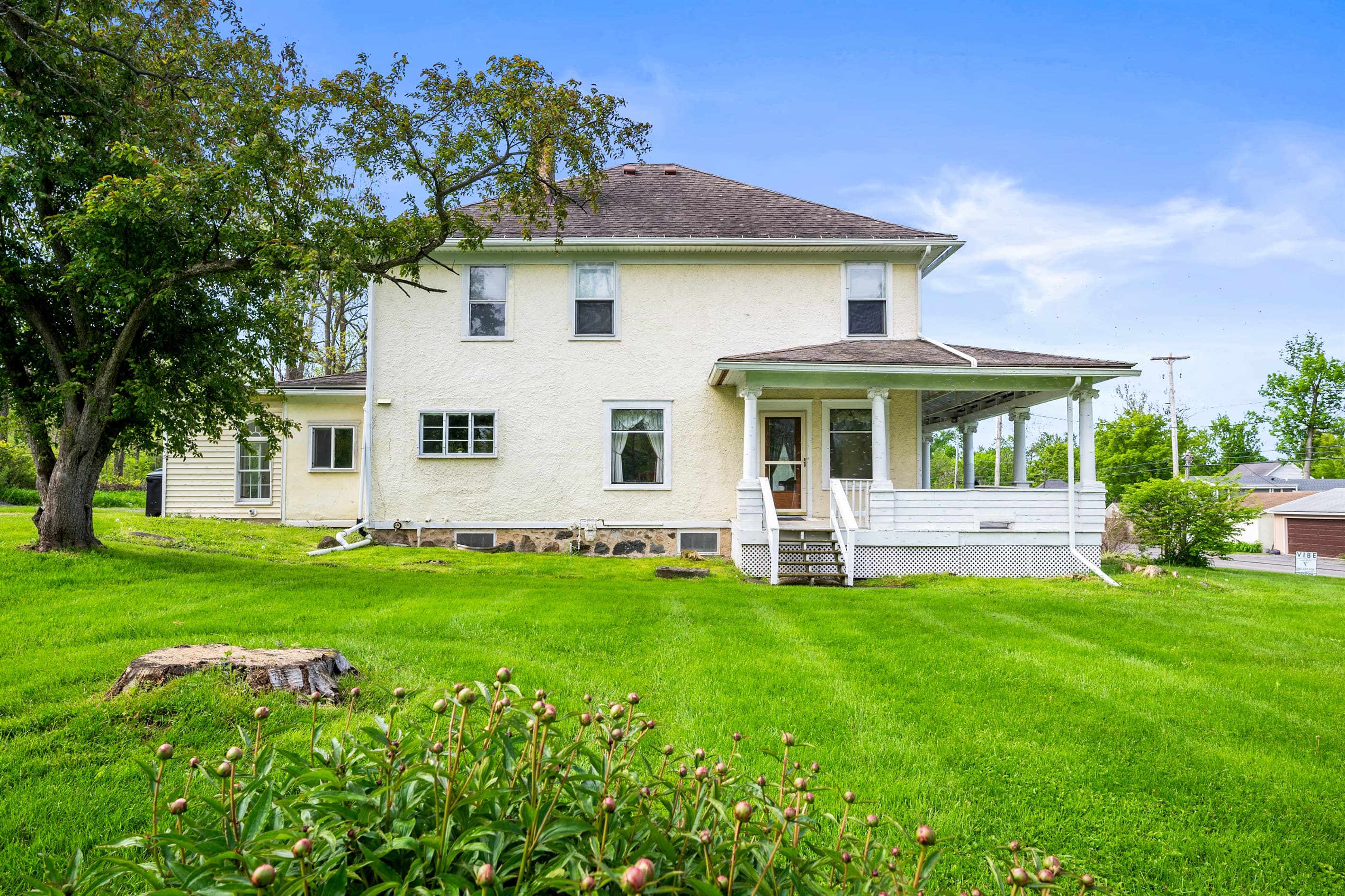 Side exterior overlooking wide lawn