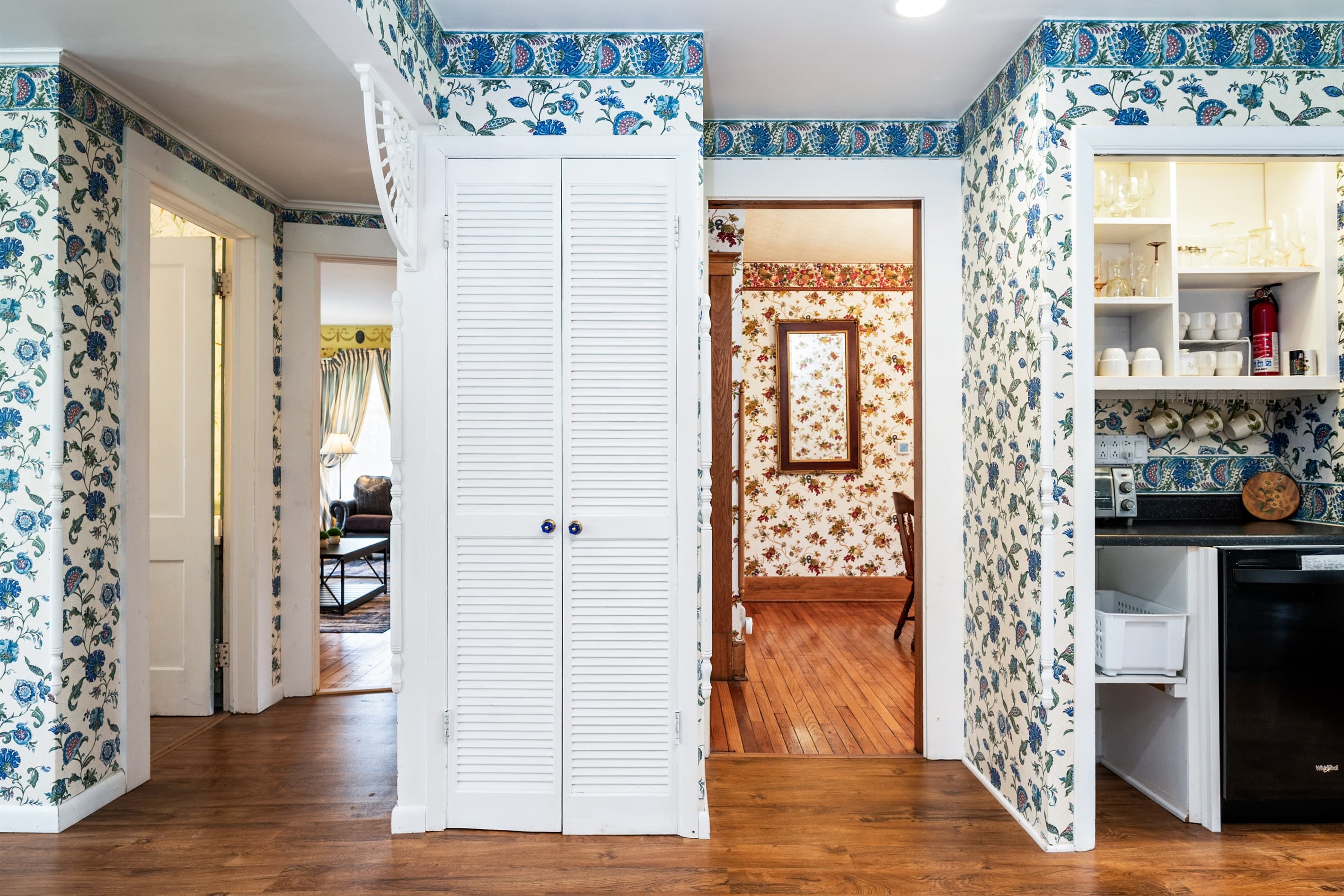 Patterned hallway with wood flooring