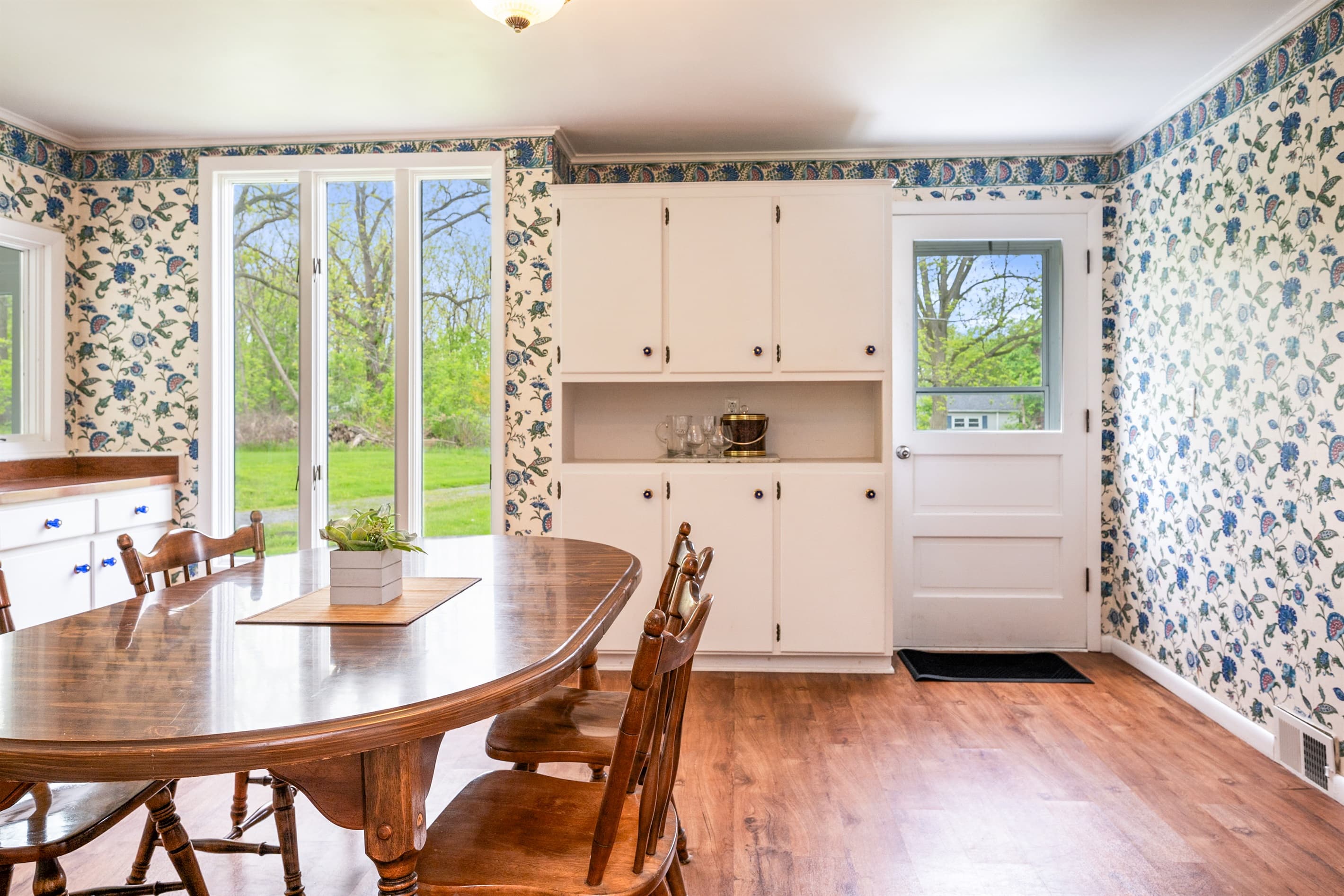 Dining area beside large windows