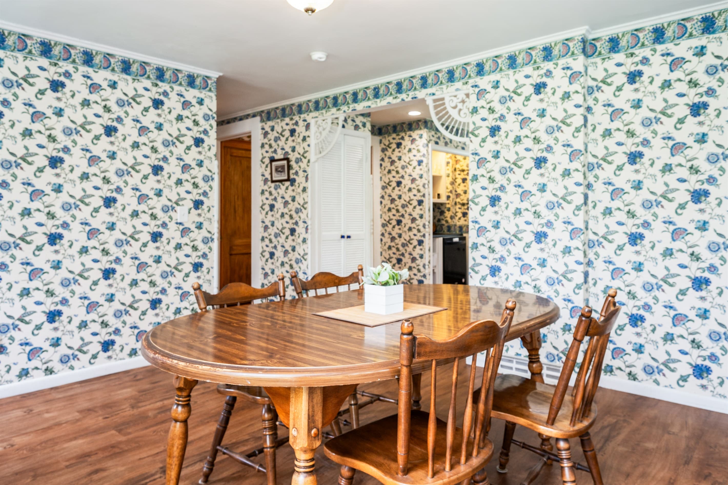 Wooden dining set against patterned walls