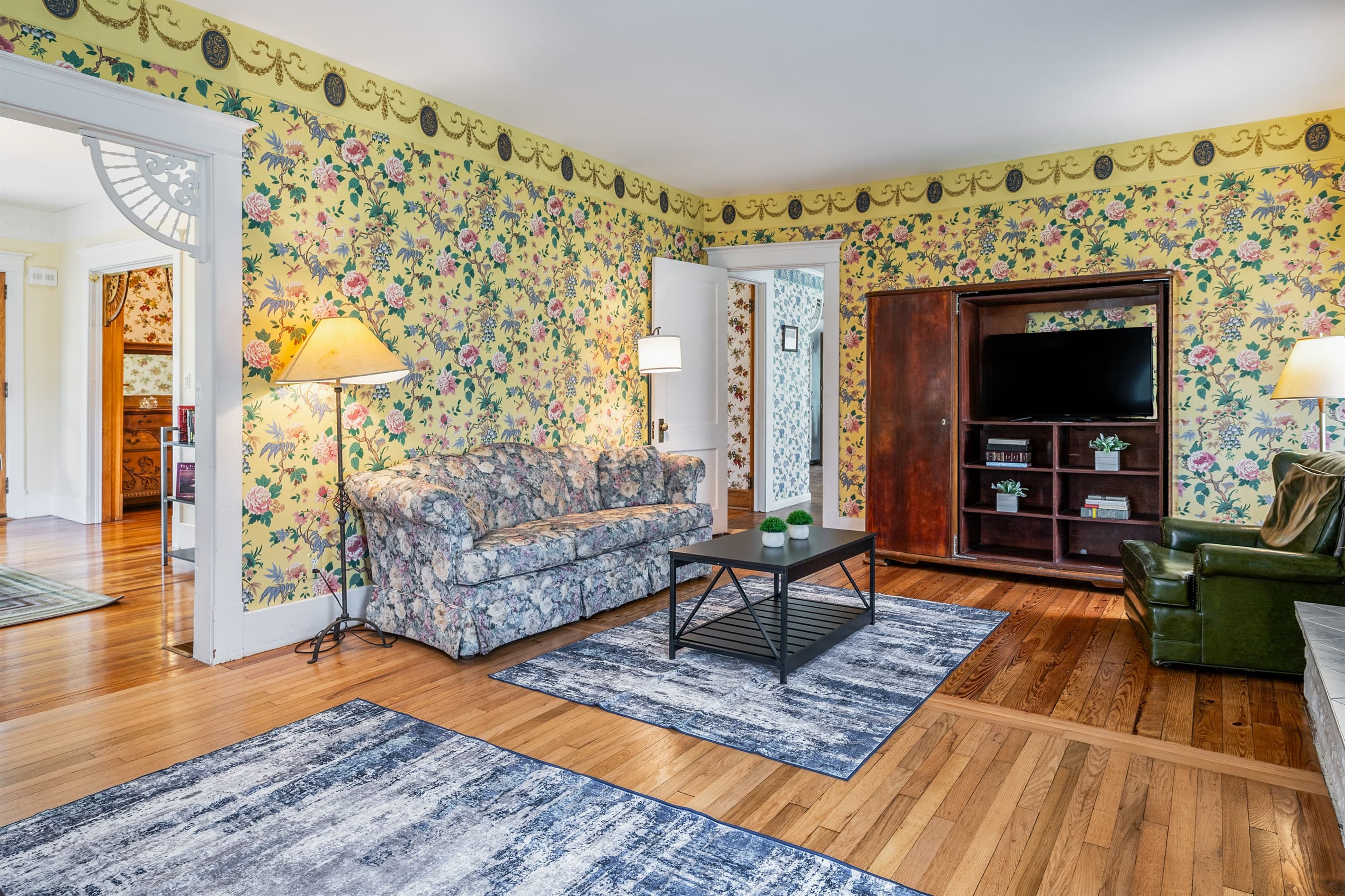 Television room with patterned wallpaper