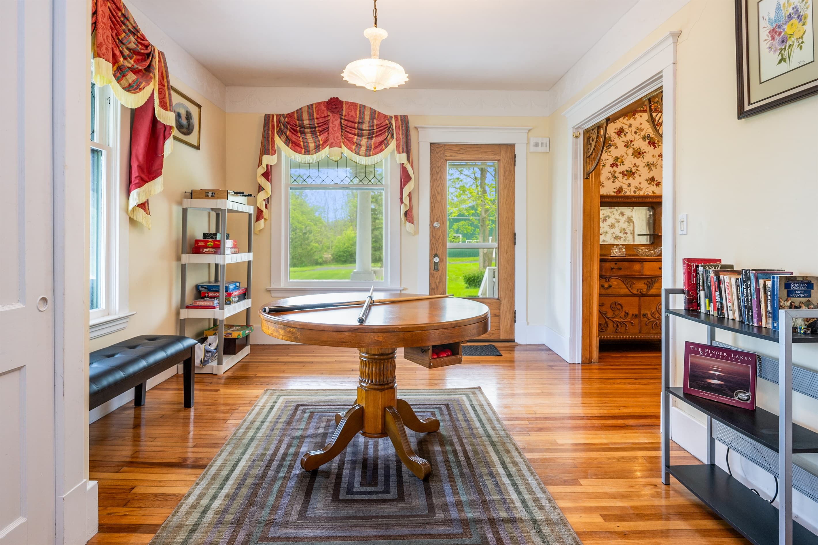 Game room with convertible pool table and seating area