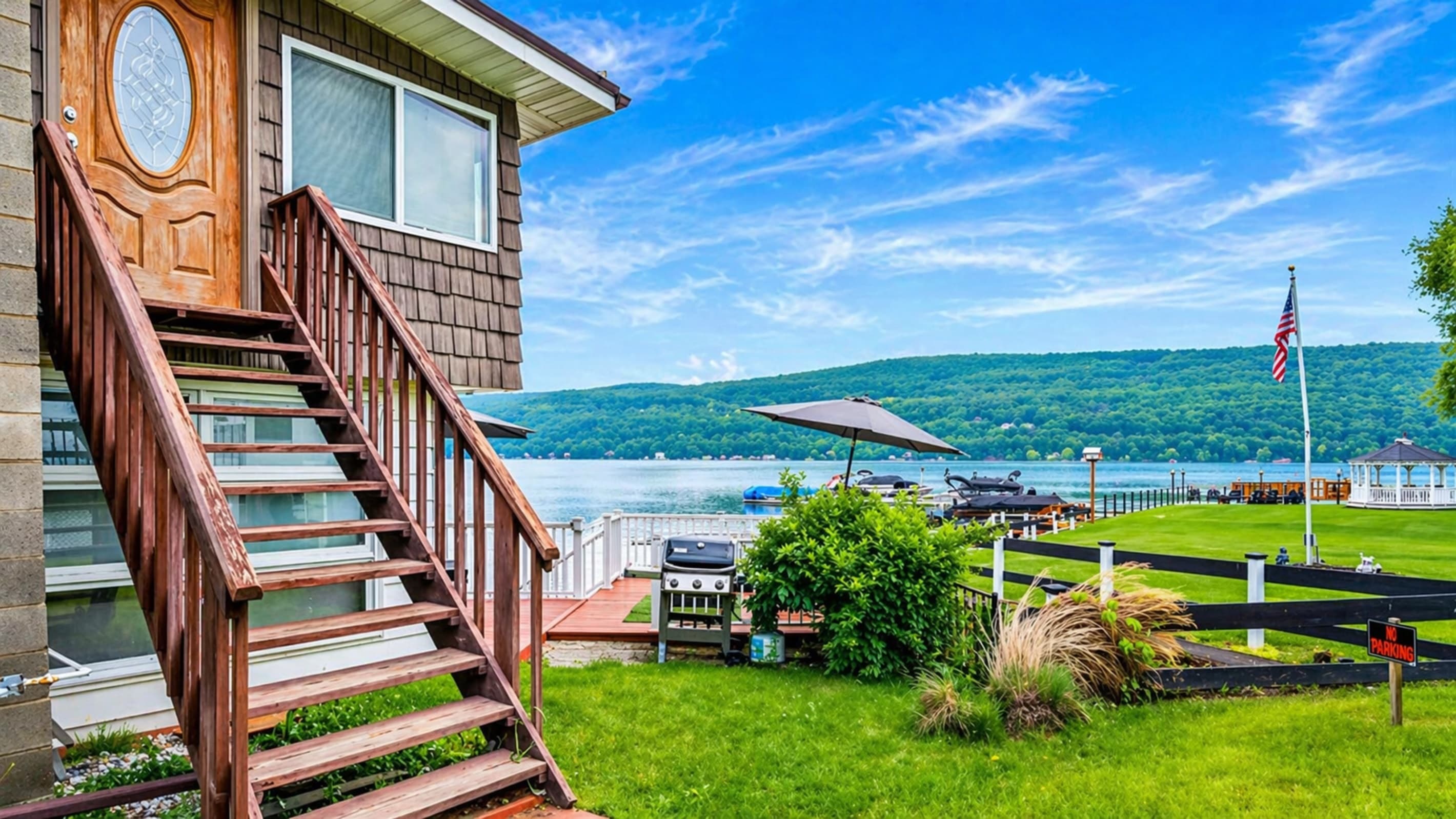 Exterior staircase beside lakefront lake