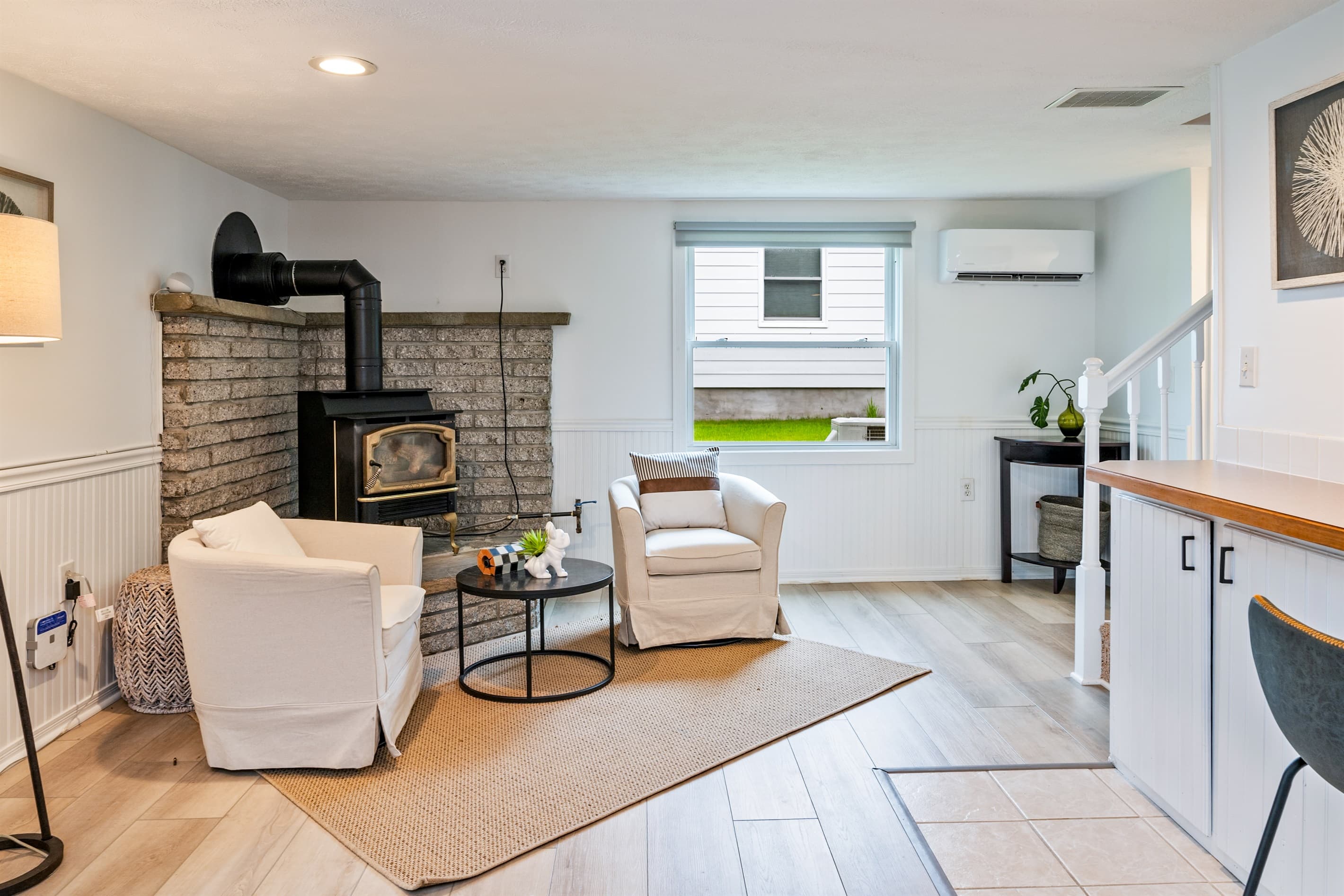 Living room with fireplace and armchairs