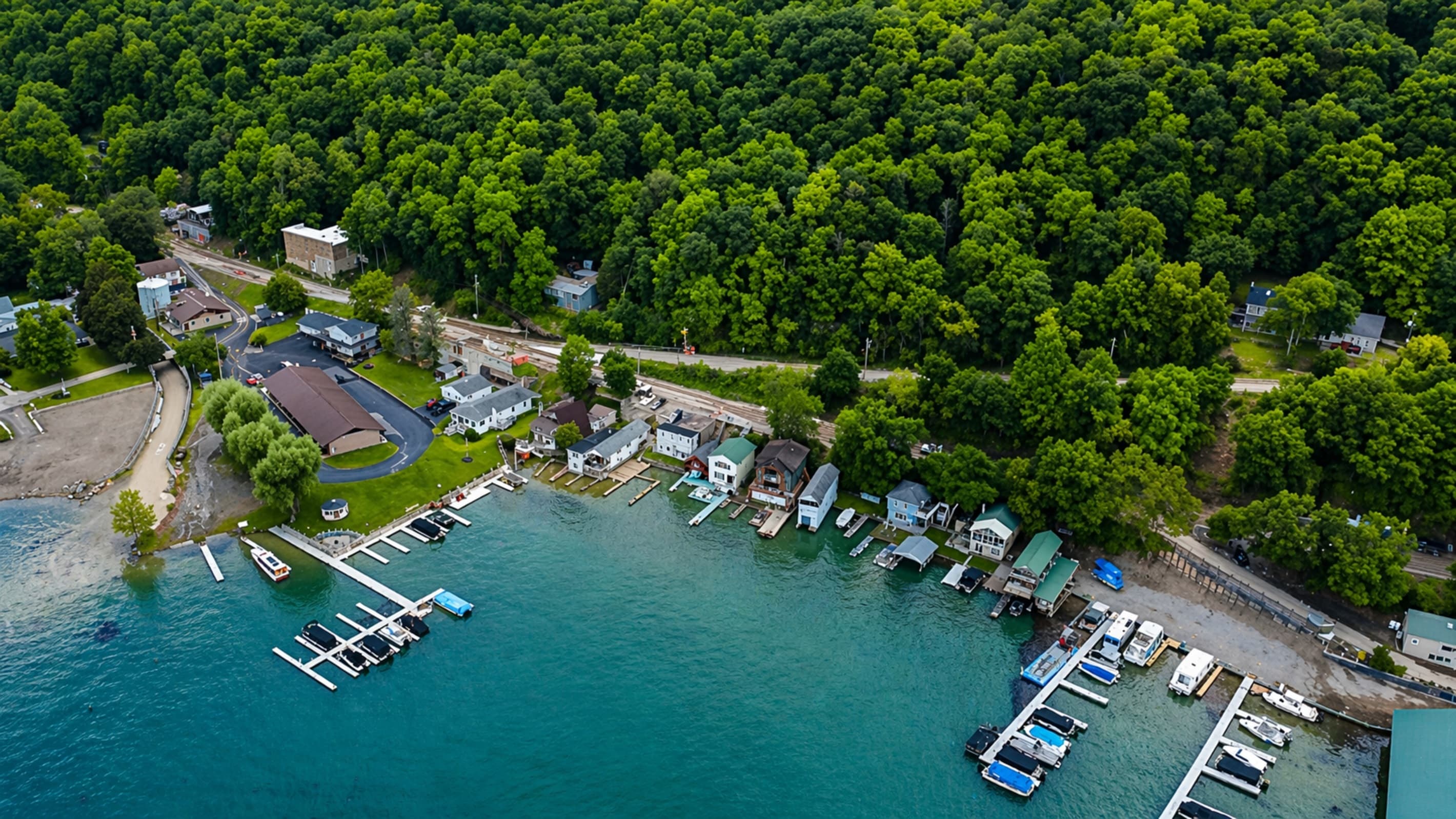 Docks extending from tree-covered properties