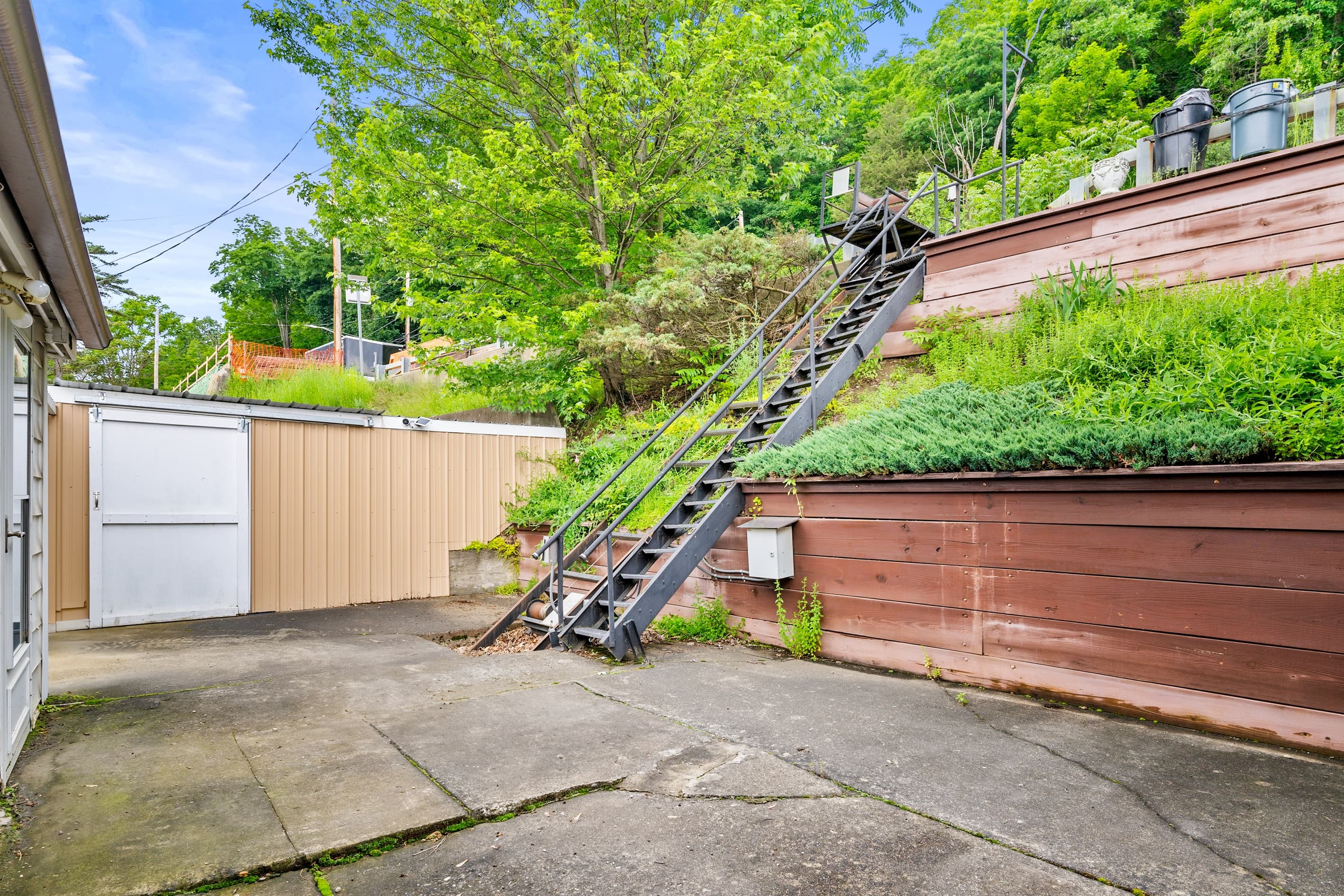 Outdoor staircase leading toward the hillside