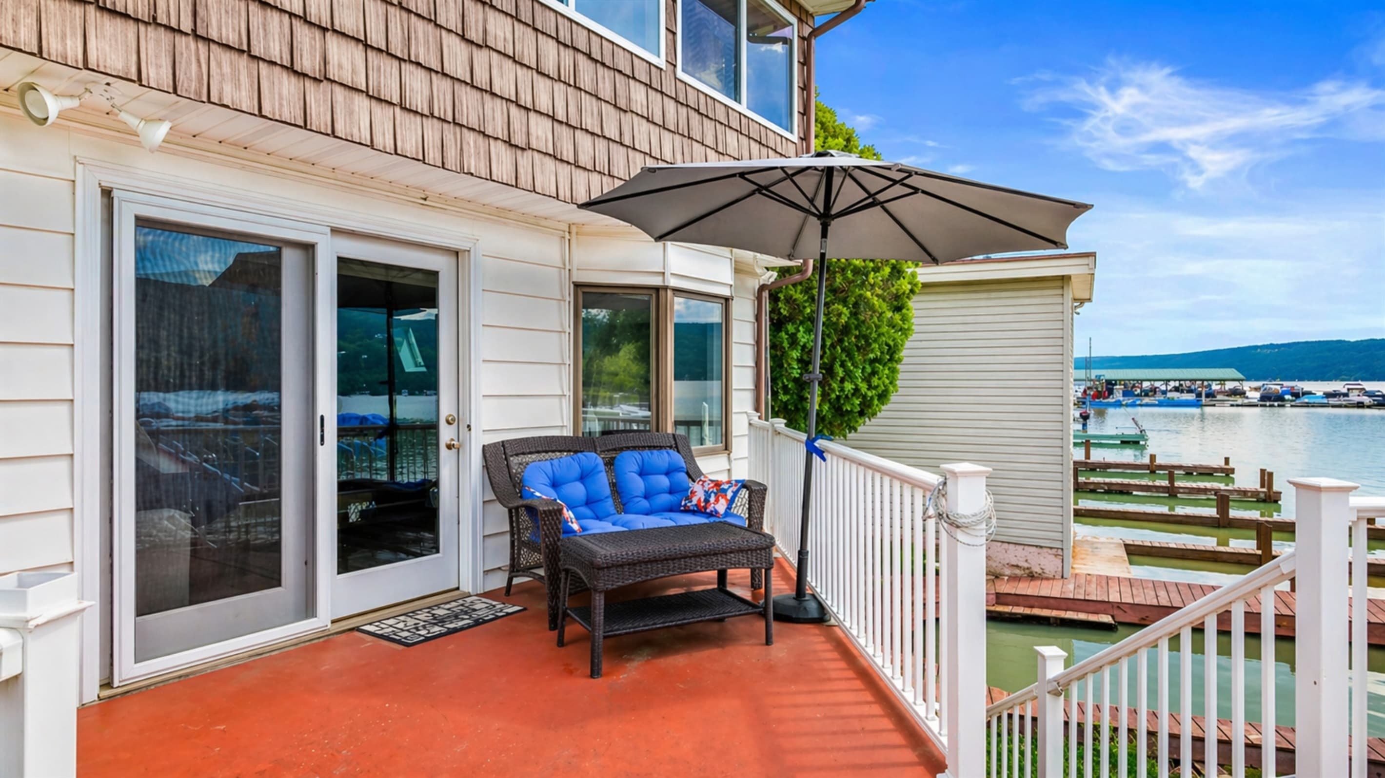 Deck seating beneath a patio umbrella