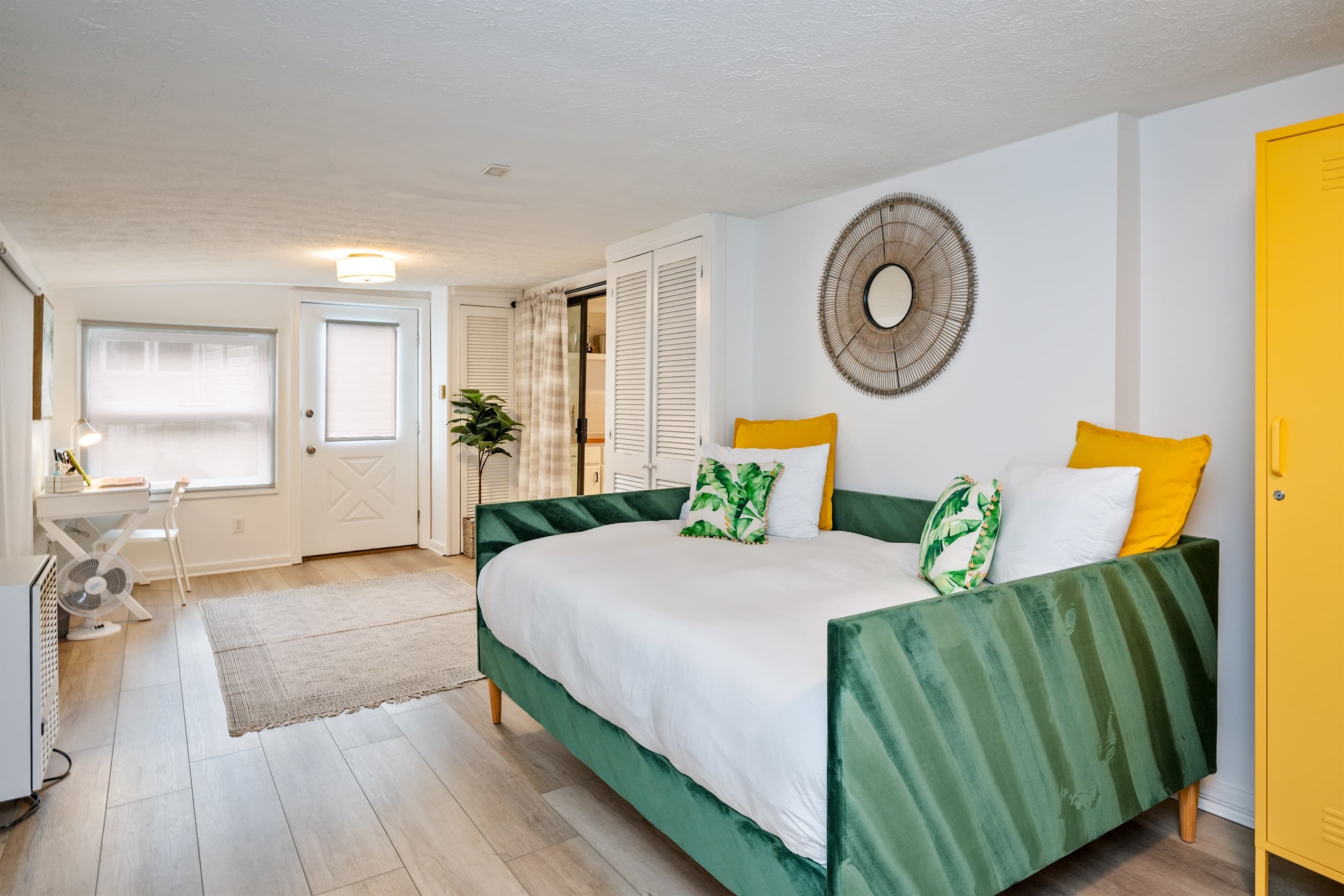 Studio bed with green upholstered seating