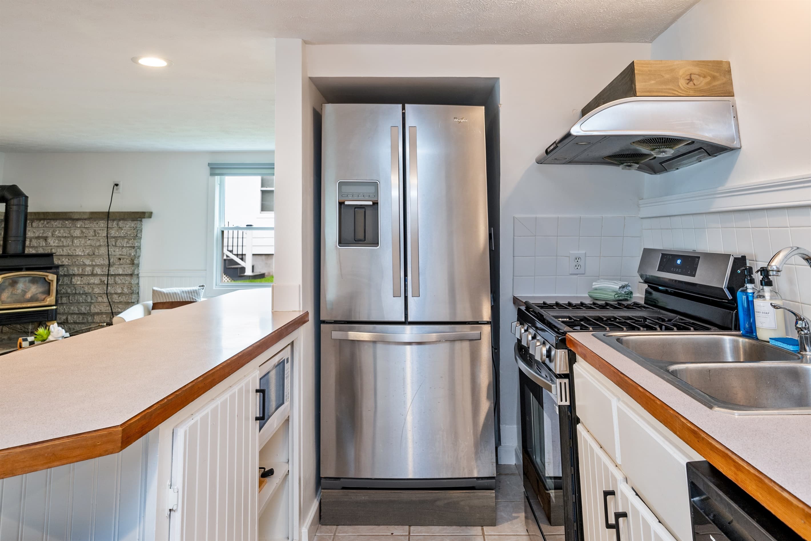Stainless steel refrigerator beside countertop